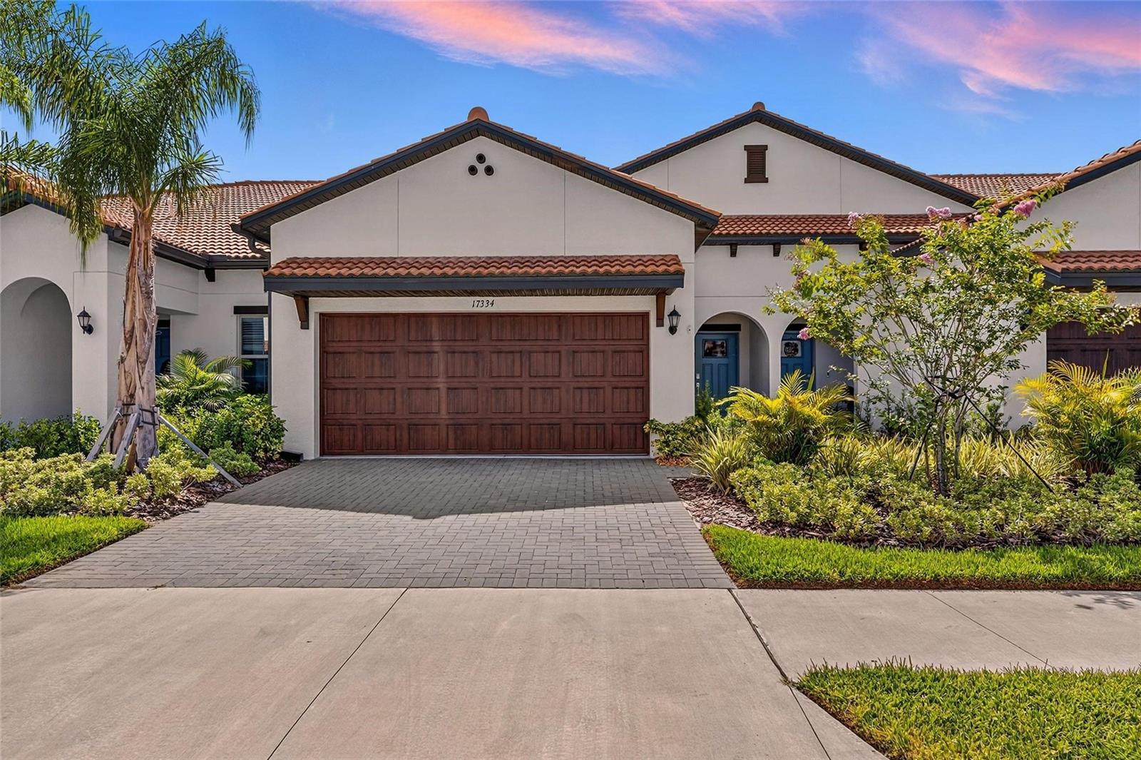 **ASSUMABLE VA 4.375% LOAN** Motivated Seller, Offering the PRISTINE condition of new construction WITHOUT the wait, this home has seen MINIMAL USE. Discover this stunning 1,737 SQFT, 2-bedroom, 2.5-bathroom home, in the vibrant and luxurious 55+ Active Adult Community that is Medley at Southshore Bay. This meticulously designed two-story Villa offers a perfect blend of comfort and style. Step inside via two-car garage or front door to an inviting OPEN-CONCEPT first level. Here, you'll find a spacious kitchen with MATCHING GE APPLIANCES, White Cabinets, and QUARTZ COUNTERTOPS. The GREAT ROOM with CROWN MOLDING throughout is ideal for ENTERTAINING. Enjoy seamless indoor-outdoor living with a TILED and SCREENED covered back PATIO, perfect for al fresco dining or simply relaxing with a cup of coffee. The owner's suite, conveniently located on the first floor, provides a PRIVATE OASIS with its en-suite bathroom and walk-in closets . Upstairs, a versatile LOFT space offers endless possibilities – a hobby room, home office, or media center – along with a comfortable guest bedroom and full bathroom, ensuring privacy and convenience for visitors. This home boasts desirable UPGRADES, including a WHOLE-HOUSE WATER SOFTENER for enhanced comfort and peace of mind. In the garage you will find EPOXY Floors, an ADDITIONAL SINK, CUSTOM SHELVING, TANKLESS WATER HEATER. In the home you'll find upgraded light fixtures. The community Southshore Bay offers a fantastic active adult lifestyle with amenities designed for leisure and social engagement. Additionally, HOA includes landscaping, internet and cable, private 55+ Clubhouse and access for you and your family into Southshore Bay LAGOON! Relax on the beach, swim in the clear blue water, and dive into the adventure with access to the WATER SLIDE, water OBSTACLE COURSE, KAYAKS, and PADDLE boards.