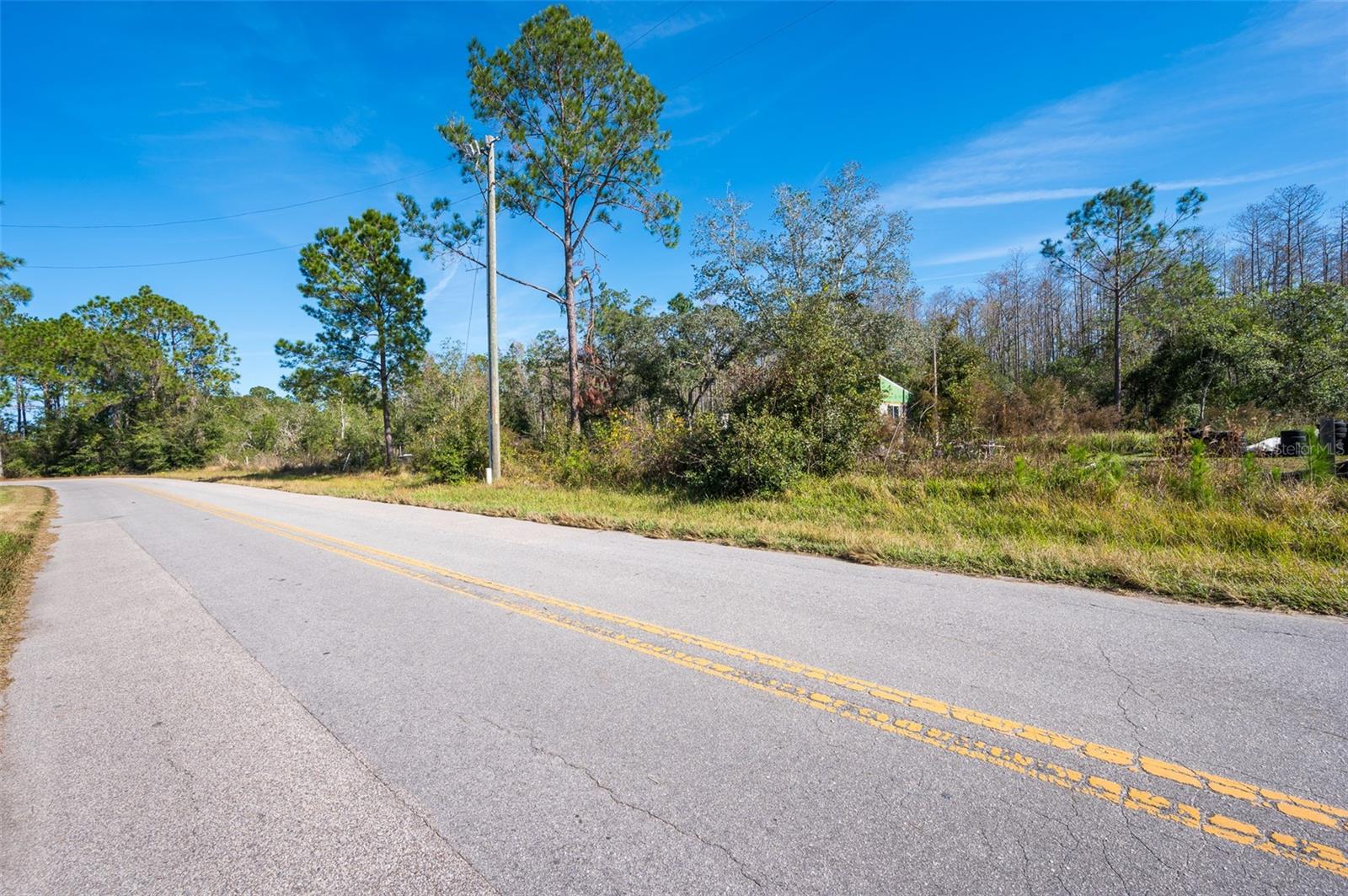Fantastic opportunity to build your dream home on 9.5 acres in desirable Clermont. Property features dual electrical access points, 820+ linear feet of road frontage great for a semi-circular driveway, and a cleared building site ready for construction. Convenient location just 30 mins to downtown Orlando, 20 mins to Disney, and 15 mins to downtown Clermont's amenities. Close to Florida's Turnpike and SR-50. No HOA restrictions. Perfect for those seeking a peaceful setting while maintaining easy access to Central Florida attractions and major highways (US-27). Remaining acreage is naturally wooded, offering privacy and the freedom to clear additional space as needed. Zoned residential with additional potential for agricultural use. Call Lake County Zoning for more details.