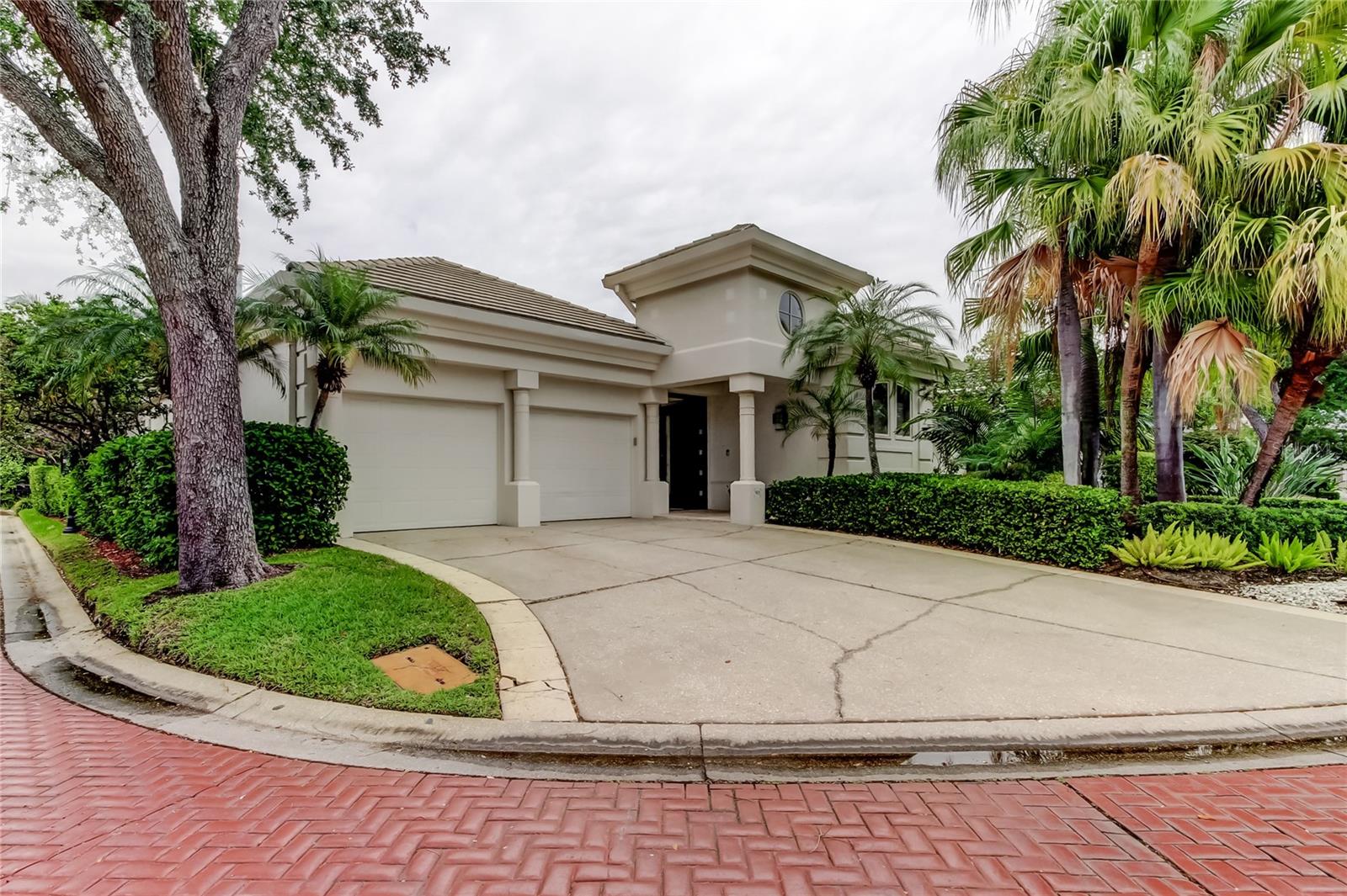 Nestled in the exclusive community Island Homes on Harbour Island, this beautiful home offers the perfect blend of luxury, comfort, privacy and proximity to your favorite shops, Amalie, the convention center, TGH, Sparkman Wharf, the riverwalk and more. Once you make your way through the private courtyard you'll enter the home and walk down the corridor to discover the expansive kitchen with custom cabinetry, beautiful countertops and a separate bar area with gas fireplace looking out to the courtyard and pool. The primary suite has his and hers walk-in closets and its own doors leading to the courtyard. The secondary bedrooms have their own bathrooms and there is a half bath for guests. Overnight guests have the option of using the guest suite, serving as the fourth bedroom, that is separate from the other living areas complete with its own bathroom and kitchenette. Unique architectural features are everywhere in this home with a barrel vaulted corridor, walk in wine room, stone floors, expansive windows, private patios and more. In the evenings, using the gate off your back patio you're just steps away from walking along the water to take in the sunsets. For the active person, you can join Life Time for outdoor tennis and pickleball courts, a resort-like pool deck, expansive workout floor, four boutique studios and lots of options for separate classes. Come see this today and secure your spot on Harbour Island!