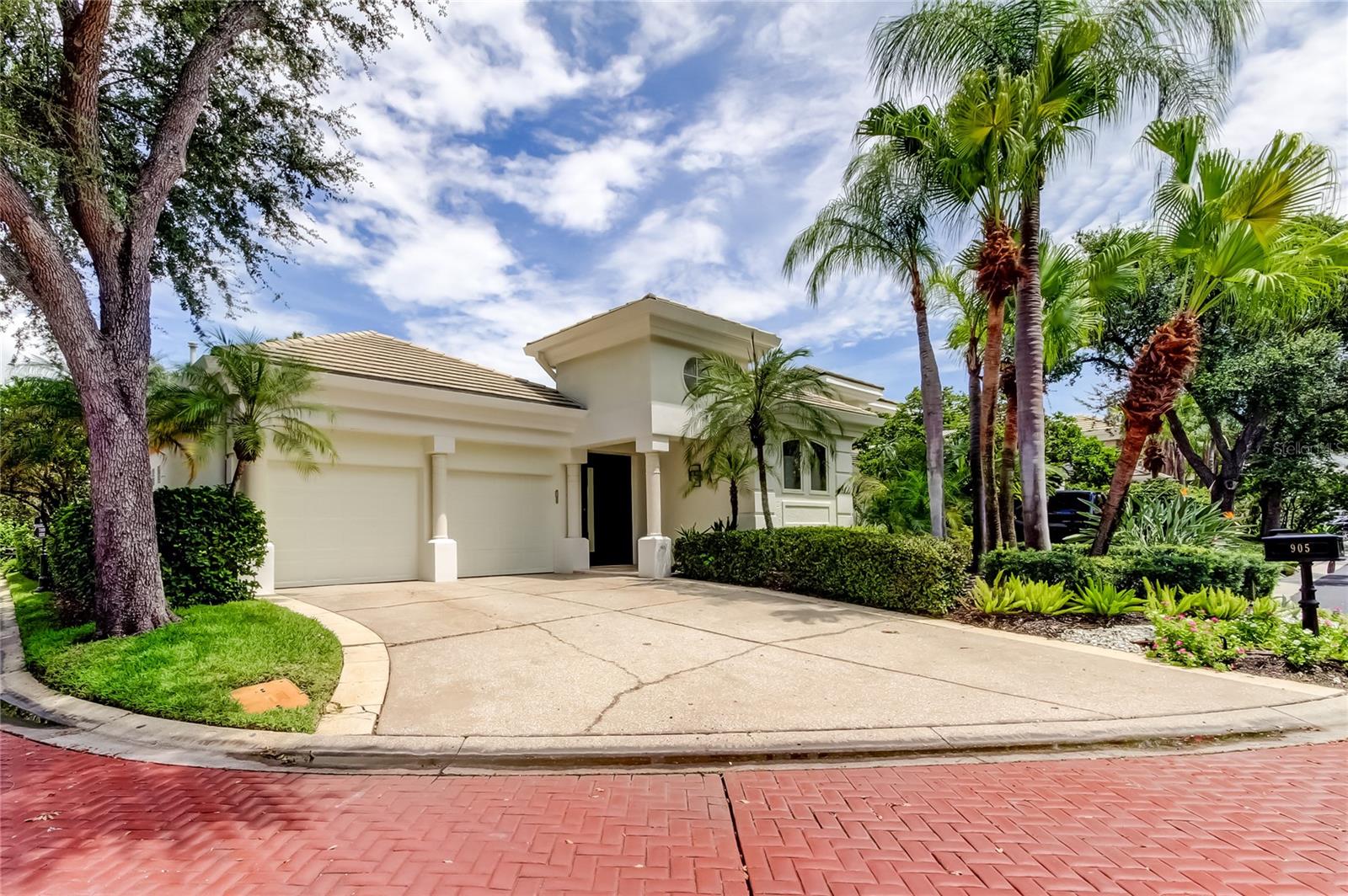 Welcome to 905 Mooring Cir, a premier retreat set amid the guard-gated enclave of Island Homes on Harbour Island where you can enjoy serene privacy while being a short stroll from high-energy hotspots like the Riverwalk, the Convention Center, Amalie (Benchmark) Arena, Water Street, Sparkman Wharf, Channelside and all of downtown. ENTERTAINER'S PARADISE - freshly painted inside and out, the home dazzles with brand-new tile work and stylish glass-shelving in the custom wet bar — perfect for hosting from day one.
ARCHITECTURAL MASTERY and NATURAL FLOW - Pass through the private courtyard into an expansive open layout that blends elegance with livability. At the center is the chef-caliber kitchen, featuring a gourmet gas cooktop, high-end appliances, bespoke cabinetry, stone countertops, and a grand island designed for cooking, gathering, and entertaining. The kitchen also includes space for a breakfast table and flows seamlessly into the bar and sitting area, anchored by a cozy gas fireplace and overlooking the courtyard and pool. This natural connection between indoor and outdoor spaces creates a home that is as functional as it is stunning.
The EXPANSIVE PRIMARY SUITE is designed as a true retreat, seamlessly blending comfort and elegance. Overlooking the courtyard and pool, it offers grand double-door access that opens directly to the sparkling outdoor area, as well as a separate private lanai entrance for moments of quiet relaxation. Inside, you’ll find his-and-hers walk-in closets, thoughtfully designed cabinetry for beauty and function, and a spa-inspired bath complete with a private shower and jacuzzi. This suite combines privacy, style, and indulgence — your own sanctuary within the home.
For the ultimate GUEST PRIVACY, each secondary bedroom has its OWN EN-SUITE, plus an additional half bath for visitors and a tucked-away guest suite complete with kitchenette, allowing guests to feel right at home.
You'll love the unique and elegant features of this home! Walk down the barrel-vaulted corridor, where artistry meets function. On the left, illuminated shelving showcases your finest displays, while on the right a glass-door closet, a large wine cooler, and a beautifully designed art niche create a striking focal point. The entrance wall and the family room wall — connected by this corridor — are finished in stunning faux/plaster paint, adding depth and sophistication to the home’s character. The corridor opens into a spacious family room overlooking the landscaped backyard, with stone flooring, vaulted windows, and expansive glass doors that flood the interiors with natural light. During the golden hour, the interplay of light through the doors, windows, and glass block transforms the space into a show of its own. Beyond, step through your private backyard gate for a serene stroll to the water’s edge and spectacular sunset views.
Embrace the ACTIVE ISLAND LIFESTYLE with health, wellness & recreation right outside your door. Just a two-minute walk around a scenic pond — home to ducks and herons — brings you to Life Time Harbour Island, where resort-style amenities await. Enjoy tennis and pickleball courts, an expansive pool deck, boutique fitness studios, and a wide variety of classes to suit every interest. Beyond the club, the entire island is a walker’s paradise, with multiple ponds, lush parks, and meandering pathways that make daily strolls both relaxing and invigorating.