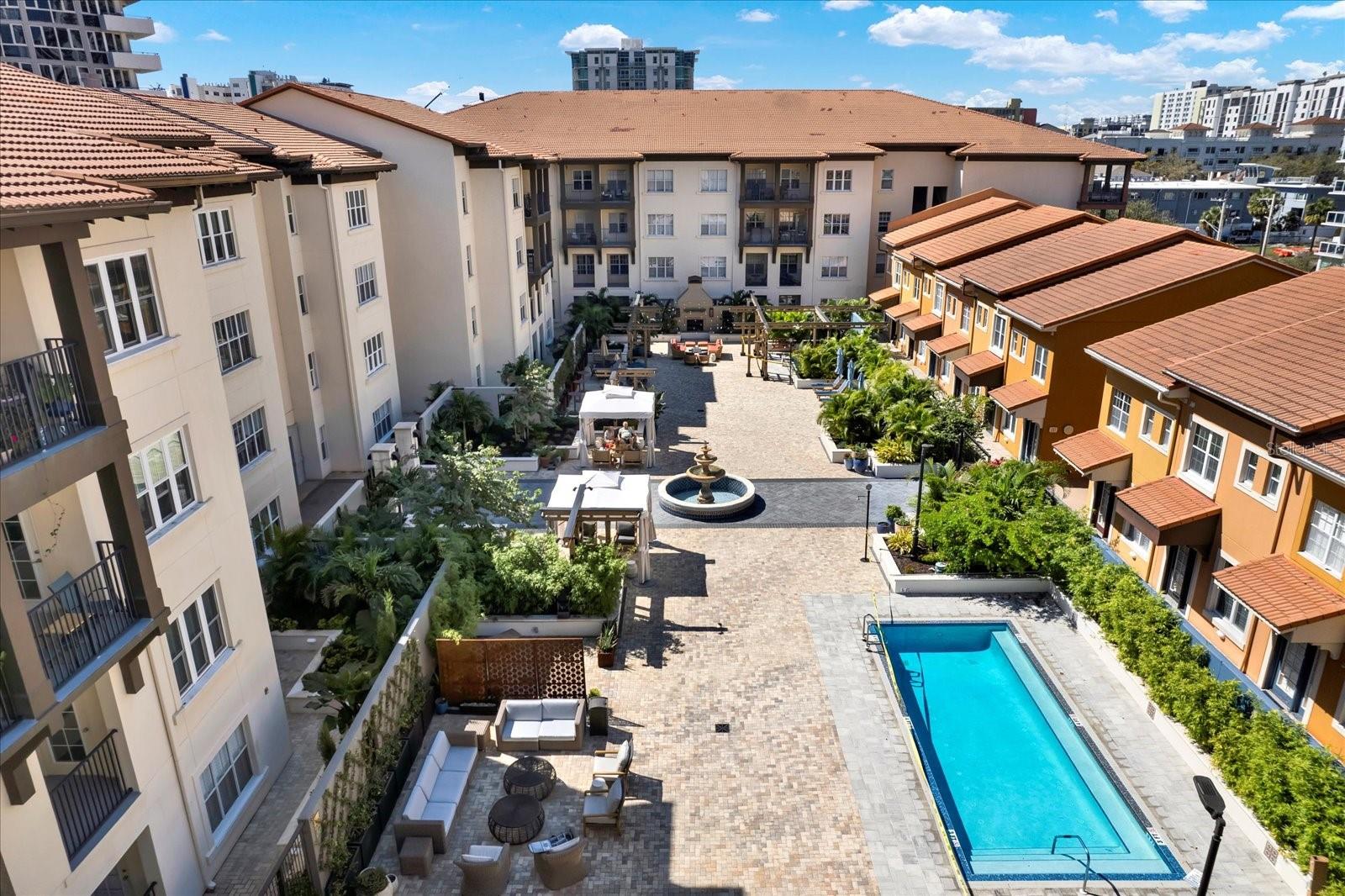 Gorgeous top floor condo with beautiful courtyard and city skyline views. This residence comes with 2 car parking (An additional $25K value. Owner has previously rented 1 of the spots for $100/mth). Live above everyone else, so no noise from neighbors walking above you. Also, balcony faces the inside, newly renovated courtyard, not the street, so enjoy more quiet time on your private outside space. The Madison is the perfect location, right in the heart of downtown yet a couple blocks off the main strip so you can have the excitement of all DTSP has to offer and still get some quiet time away from the hustle and bustle. Over 1,200 sq ft including 2 bedrooms with ensuite 2 bathrooms on opposite ends of the residence, great for guests or office/work space separation. Beautiful luxury vinyl flooring all throughout the home. Renovated kitchen with quartz countertops, stainless steel appliances, designer backsplash and pendant lighting. Each bedroom has ceiling fans and walk in closets. Primary bedroom has renovated bathroom with fantastic marble shower and double sinks. 2nd bedroom bath has soaking tub. Living room and dining room has modern lighting throughout. Walk out the back door to your very own private balcony overlooking the city skyline and also the community's newly renovated pool, spa, courtyard area. Both bathrooms and kitchen have been renovated so just move in and enjoy! Large separate storage area just outside unit door to the right, perfect for a little workspace or holding additional items. Great amenities such as secure, gated access. Swimming pool, spa/jacuzzi, fireplace, grills plus a Fitness center located in Building 100 next door. Great value for a newly renovated condo with 2 car garage parking! Drapes/window treatments stay with new owner. Some furniture negotiable. Condo fee also includes Spectrum cable tv an hi speed internet