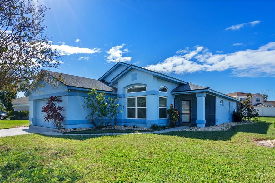 PRICE IMPROVEMENT! Now's your chance to own this home, lovingly cared for by the original owner. Complete with a SPARKLING POOL, this beauty is located on 1/5 acre in the Spring Lake community. EXPLORE THE HOME WITH THE VIRTUAL TOUR and VIDEO WALK THRU LINKS. Through the front door, the foyer opens to an airy family room bathed in natural light with high ceilings and beautiful wood flooring. Out the sliding glass door you’ll find a screened pool deck, perfect for weekend barbeques and relaxing with family and friends! The kitchen is located toward the front of the house and features ample cabinetry and counterspace for the family cook to prepare meals. An adjacent living space to the kitchen is just as easily used as a cozy family room as an eat-in kitchen. The bedrooms are configured as a popular split floorplan with the secondary bedrooms surrounding a full bath on one side of the house, and tucked behind an elegant sliding barn door for additional privacy. The primary suite features high ceilings, double closets, double sinks, and a large step-in shower. Other notable features include a screened front porch, new roof (August 2023), and the house comes with front loader washer and dryer. Come put your personal touch on this well-maintained home! The Meadow Woods area has plentiful shopping and restaurants within it, a Sun Rail Station, is close to The Loop, and located just 15 minutes to the airport, Medical City, and close to our Central Florida Theme Parks!