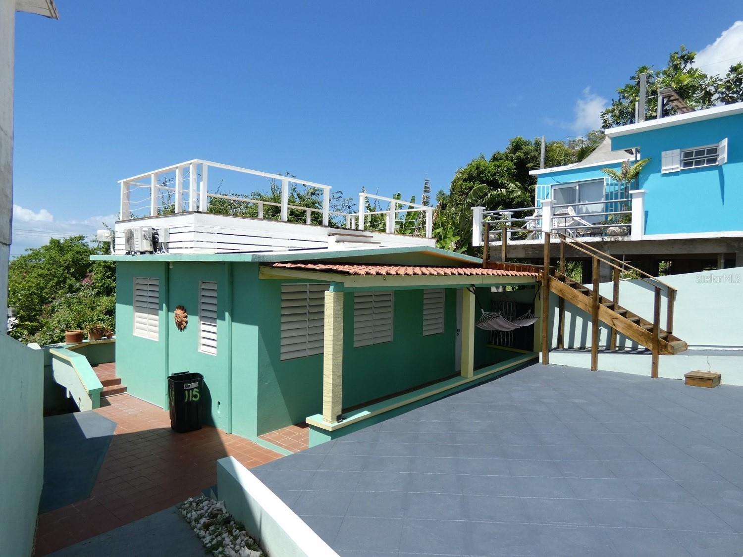 ADORABLE COTTAGE WITH VIEWS IN MAMBICHE! Super cute one bedroom home on a 207.30 square meter lot in Mambiche. Roof-top deck with views of the Ocean, the Fort, and the sunset and the stars. Walking distance to restaurants, bars & shopping in Isabel II. Solid concrete construction. Modern cement counters, built-in couch & dining table. Ceiling fans & air conditioning throughout. Remodeled bath. Full laundry & storage area just off the master bedroom. Easy maintenance terraced front yard suitable for growing flowers, vegetables, or an herb garden. Cement patio area (with access from master bedroom) for barbequing, exercising or just relaxing in the sun, as well as providing space for future expansion, or even a cocktail pool. Sidewalk cut-out parking. Perfect for quick getaways, or vacation rentals. Fully furnished and move in ready. Titled.
