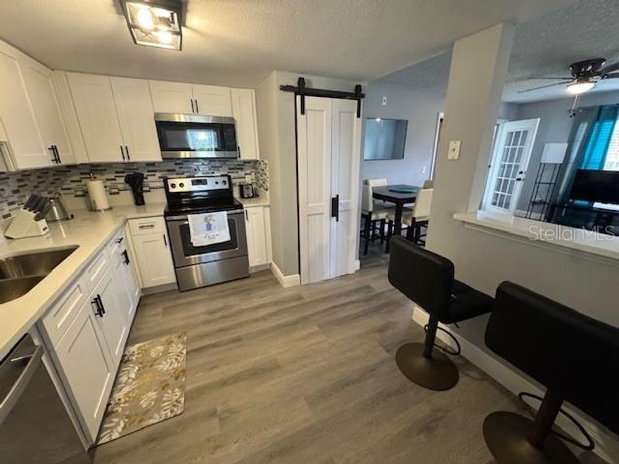 Newly renovated 2/2 end unit condo on 2nd floor. Property features updated kitchen with new cabinets, stainless steel appliances, garbage disposal and quartz countertops. Property also features porch/ balcony and inside laundry area. Both master bathroom and guest bathroom was completely remodeled throughout. New luxury vinyl flooring installed throughout home. Golf course community with access to community pool