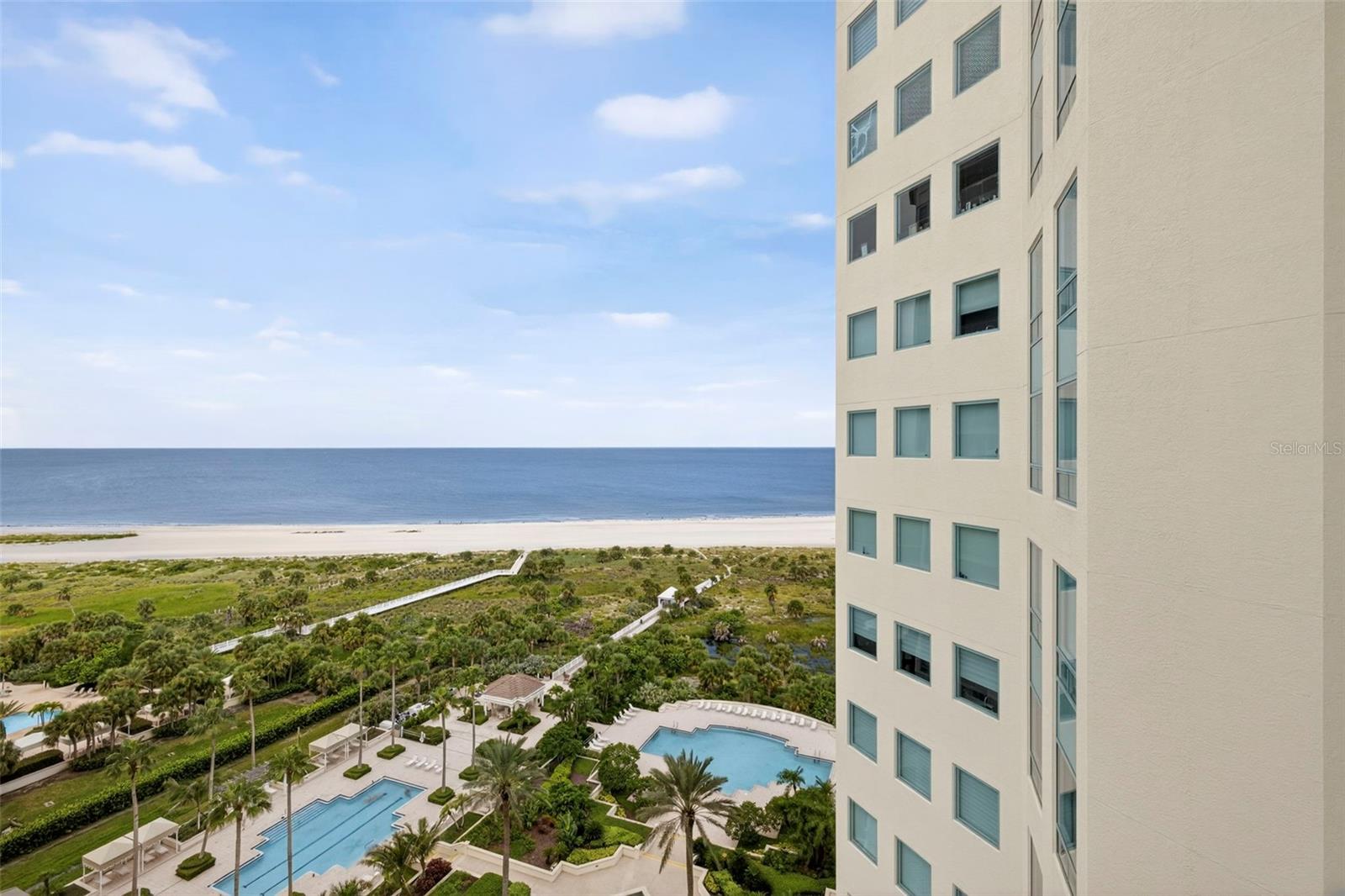 AVAILABLE OCTOBER 2025-MARCH 2026 Welcome to the Grand on Sand Key! A gated, secure building offers a convenient split floorplan with 2-bedrooms, 2 baths. Sleeps 4-5 in luxurious comfort steps from the beach and surrounded by amazing water views of the Gulf and intercoastal waterway. Pictures don't do it justice. Amazing decor everywhere, fit for an ultimate beach experience of comfort and relaxation! Enjoy cocktails or your morning coffee on the large balcony and soak up the Florida sunshine. A fully stocked kitchen, comfy furnishings, splendid décor and in-unit laundry make this a perfect escape from cold winters! The building offers all the amenities of a 5-star resort hotel, including a fitness center, tennis courts, swimming pools, hot tub, concierge service, a cozy library area, club room and much more. Located on beautiful Sand Key, the location can’t be beat! Walk across the street to enjoy excellent restaurants and shopping. Or hop on the Jolley Trolley right outside for a night on the town in Clearwater Beach just minutes away. Want to learn to sail while you’re here? The Clearwater Sailing Center is nearby too! One assigned parking space and two entry fobs come with the unit. EASY commute to Clearwater or Tampa. Tampa International airport 30-min away. PIE airport 15 minutes away.