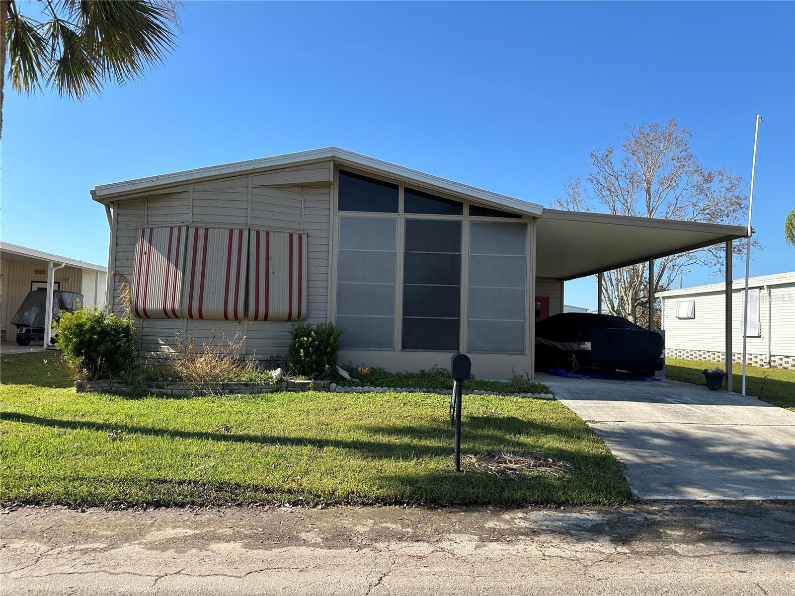 WELCOME TO THE WATERFRONT COMMUNITY OF HARBOR COVE! Lots of room in this spacious fully furnished 2-bedroom 2 bath home with a den, a sun porch with vinyl windows which doubles as an all-weather room. Lots of storage, Newer AC, newer vinyl siding, granite counter tops, all appliances including washer & dryer. Roof re-sealed 2024. Enjoy this Beautiful Boating community on the Myakka River giving you access to Charlotte Harbor. Boat Slips available as well as extra storage for campers, trailers, cars, etc. for a small yearly fee. Very Active community with Tennis Courts, two pools, hot tub, fitness room, workshop, pickle ball, art room and much more. Ideal location close to shopping, medical, golf, I-75 and white sand beaches.