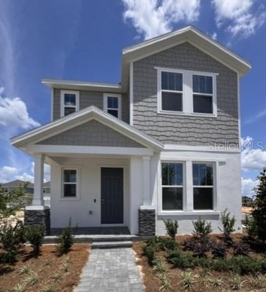 Discover the charm of our only move-in ready Overlook bungalow home in Cypress Bluff situated on a beautiful corner homesite! This thoughtfully designed 3-bedroom, 2.5-bath home features a first-floor Primary Suite with generous walk-in closet and en-suite Bath, impressive 9'4" ceilings on 1st floor, and a spacious second-floor loft—perfect for a home office or media room. Stylish upgrades include window blinds throughout, tile flooring in the 1st floor main living areas, and an open-concept layout that connects the living, dining, and kitchen spaces seamlessly. The upgraded kitchen boasts 42" cabinets with crown molding, quartz countertops, a sleek tile backsplash, and stainless steel appliances, all overlooking a cozy covered side porch. Located in the desirable Cypress Bluff community with future amenities like a pool and playground, and just minutes from the Florida Turnpike, shopping, and dining—this home offers the perfect blend of style, comfort, and convenience.