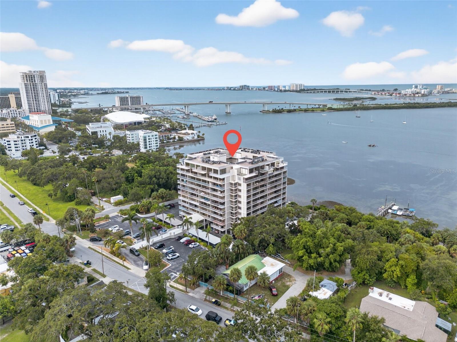 Discover this stunningly updated 2-bedroom, 2-bath waterfront condo that's located in the sought after community of Harbor Bluffs, where coastal living meets modern comfort. Perfectly positioned along the intracoastal waterways, this residence showcases panoramic water views and a lifestyle defined by relaxation and convenience. Upon entry, you’re welcomed into an open-concept living and dining area that seamlessly extends to an expansive balcony—accessible from the main living space and both bedrooms. Step outside and enjoy your morning coffee, outdoor dining, evening sunsets, or simply take in the tranquil waterfront scenery. The kitchen has been refreshed with brand-new stainless steel appliances, while a convenient in-unit stackable washer and dryer adds everyday ease. Both bathrooms have abundant storage space throughout to ensure everything has its place. A versatile second bedroom, accented with sleek glass partition doors, easily transitions into a guest suite, home office, or flex space to suit your lifestyle. Additional storage is provided with a private, onsite storage unit. The community itself offers an inviting coastal retreat. Stroll through the landscaped courtyard to a lush lawn that flows directly to the serene waterfront pool—an ideal spot for lounging or entertaining friends. Additional amenities include a fully equipped fitness center, a recreation room with sweeping water views, and a large pool designed for year-round enjoyment. Reserved, gate-access parking adds peace of mind and convenience. Recent upgrades include a new A/C system installed in 2020, professional air duct cleaning in 2025, and a completed Milestone inspection, giving you confidence and value from day one. Perfectly located just 1 block from the Pinellas Trail and just minutes from Clearwater’s award-winning gulf beaches, vibrant downtown dining and entertainment, and less than 30 minutes to Tampa International Airport, this condo combines carefree living, modern updates, and unbeatable waterfront access. This property is turn-key ready to be your private coastal sanctuary.
