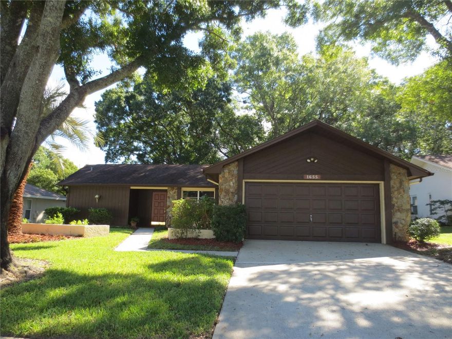 One story, single family, split bedroom, detached home with 2 bedrooms each with walk in closets, 2 bathrooms and 2 car garage on beautiful quaint treelined cul-de-sac street. Features include eat in kitchen, ceiling fans in each room, huge rear screened in patio and tile throughout. 55+ community, Highland Lakes, offering tons of activities to include olympic sized pool, hot tub, no greens fee 27 hole golf course, bocce, tennis, shuffleboard, club house, auditorium, dinners & dances, wood shop, ceramics & art studio, free RV & boat storage and access to Lake Tarpon. Situated near schools, churches, shopping centers and major thoroughfares. Lawn maintenance and access to all amenities are included in rent.