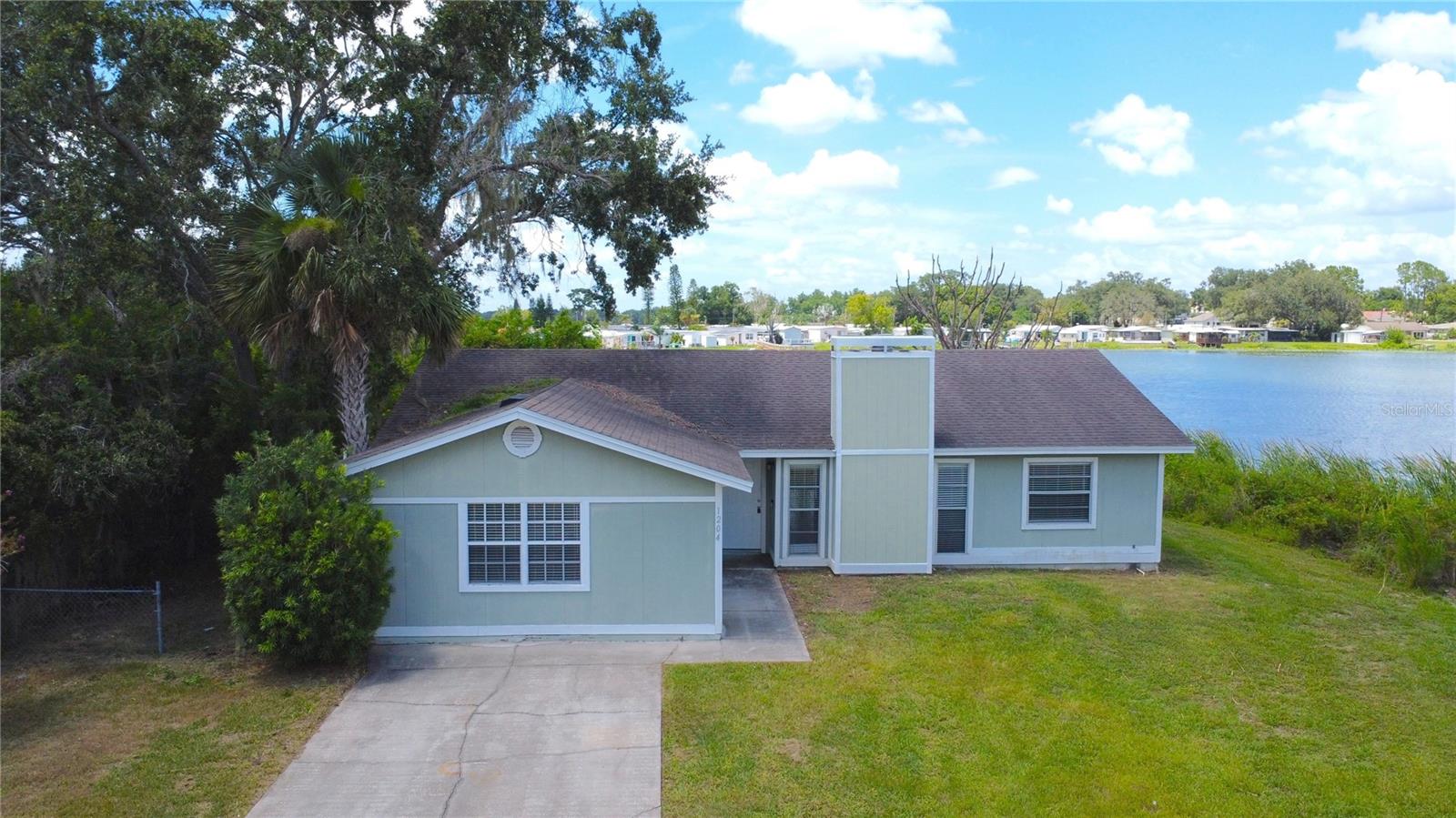 Enjoy the Florida lifestyle in this spacious lakeview home located at 1204 Honeytree Lane West in Lakeland. With 4 bedrooms and 2 full bathrooms, this single-family home offers over 2,100 square feet of living space, including a large air-conditioned Florida room. The property also features a fireplace, masonry/block construction, and sits on a 0.36-acre lot. Rent is $2,000/month and includes lawn maintenance. Security deposit is $2,100 WE OFFER A SECURITY DEPOSIT ALTERNATIVE. The application fee is only $80/adult. In addition to the advertised base rent, all Lakeland Homes and Realty tenants are enrolled in the Resident Benefits Package (RBP) for $50/month (ex.: $2,000 (base rent) + $50 (RBP) = $2,050 total monthly charge), which includes HVAC air filter delivery to your door (for applicable properties), credit building to help boost your credit score with timely rent payments, $1M Identity Protection, $100K Personal Property Insurance, utility concierge service making your move-in less stressful, our resident rewards program benefits, and much more! More details upon application. Call to schedule appointment today.