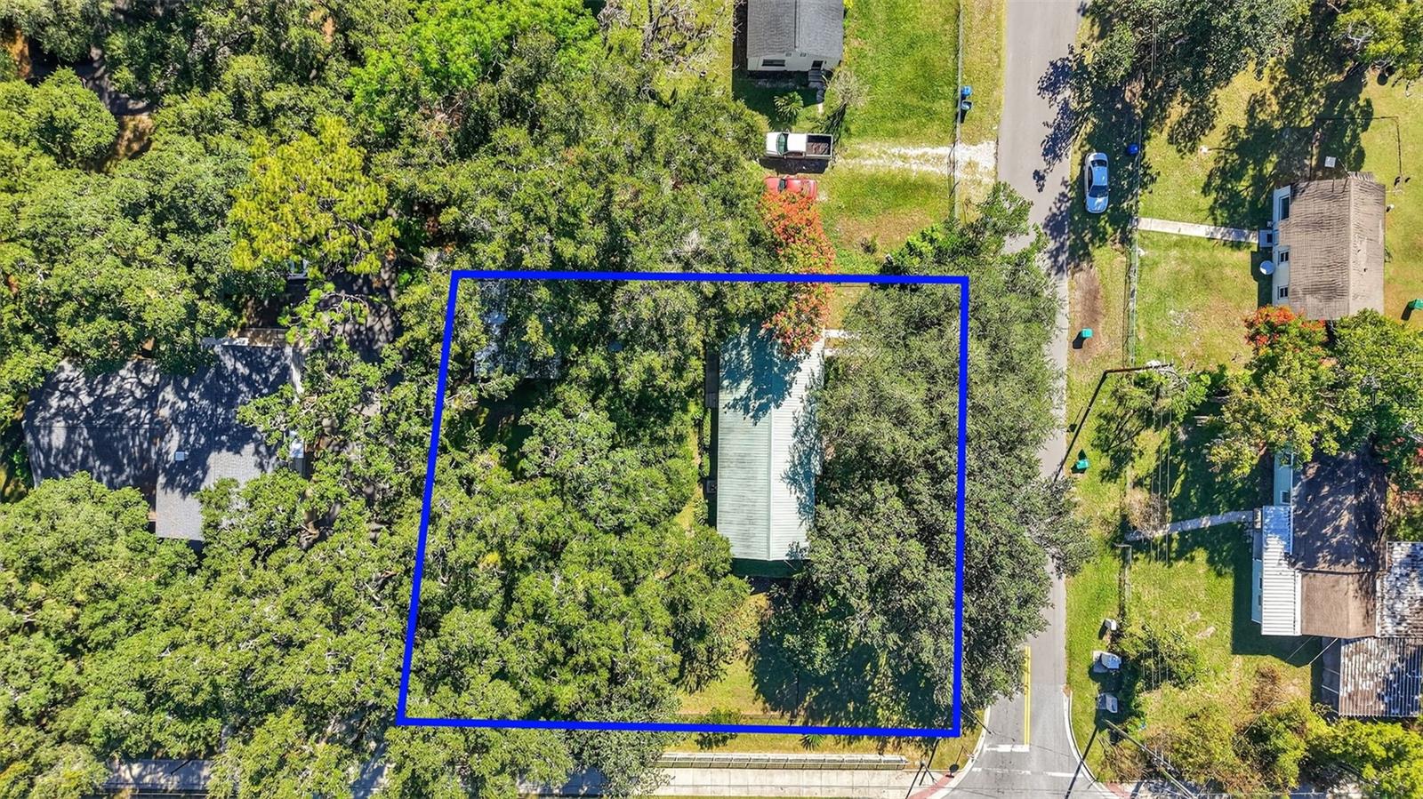 One or more photo(s) has been virtually staged. FANTASTIC BUSINESS OPPORTUNITY with ENDLESS POTENTIAL in a PRIME LOCATION just outside of The Villages! IDEALLY SITUATED, this CHARMING 4- Bedroom, 1-Bath home sits on .41 acre on the CORNER of CR466A and Gray Ave offering IMMENSE VERSATILITY and EXCELLENT PROSPECT as a primary residence, or investment/business venture! SO MANY POSSIBILITIES! NO HOA! Direct access to CR466A with an ABUNDANCE of shopping, dining, banking, medical, and more! Also, close to Brownwood Paddock Square with live nightly entertainment and weekend farmer’s markets! A LARGE, FRONT DECK welcomes you to this WONDERFUL home and provides the perfect spot to relax and sip your morning coffee or snuggle up with a good book! Step through the front door with a decorative oval-shaped, LEADED-GLASS window into the SPACIOUS, OPEN CONCEPT living and kitchen area. The AMAZING, UPDATED kitchen features WHITE CABINETRY with PULL-OUTS; GRANITE countertops; TILED backsplash; DOUBLE built-in PANTRY; STAINLESS appliances; and an EAT-In breakfast bar. The ADJACENT living room features two large windows for ABUNDANT NATURAL LIGHT. RICH, WARM, HARDWOOD flooring graces the living, dining/bonus room, and three bedrooms. A rear BONUS ROOM features TRIPLE windows overlooking the peaceful backyard and green space. This VERSATILE ROOM offers the ideal space for a dining area, den, or media room An exterior door, off of this area, allows for easy access to the rear and side yards. The EXPANSIVE, FULLY FENCED backyard provides privacy and PLENTY of space for family, pets, or outdoor projects. THREE STORAGE SHEDS and a SPACIOUS 20’x24’ CARPORT offer AMPLE room for vehicles, tools, and hobbies. There’s also a REAR PATIO for grilling or simply enjoying the BEAUTIFUL Florida weather! From the patio, an additional exterior door invites you back inside to the primary bedroom boasting a VAULTED ceiling, CROWN MOLDING, SPACIOUS WALK-IN closet, and LAMINATE floors. The bathroom features TILE flooring, a WHITE vanity and countertop, a TILED tub and shower combination, and TWO hallway LINEN closets. Three additional bedrooms, with HARDWOOD floors, are located near the main living area, and offer the perfect space for additional sleeping, an office, or a hobby room. One features a WALK-IN closet and the other two have built-in closets. Completing the package is an INTERIOR LAUNDRY with an ABUNDANCE of SHELVING for storing laundry essentials, cleaning supplies, linens, etc. WITH SO MUCH POTENTIAL, THIS INCREDIBLE HOME WON’T LAST LONG! PLEASE WATCH OUR WALKTHROUGH VIDEO of this AMAZING PROPERTY in a PRIME LOCATION, and call today to schedule your Private Showing or Virtual Tour!