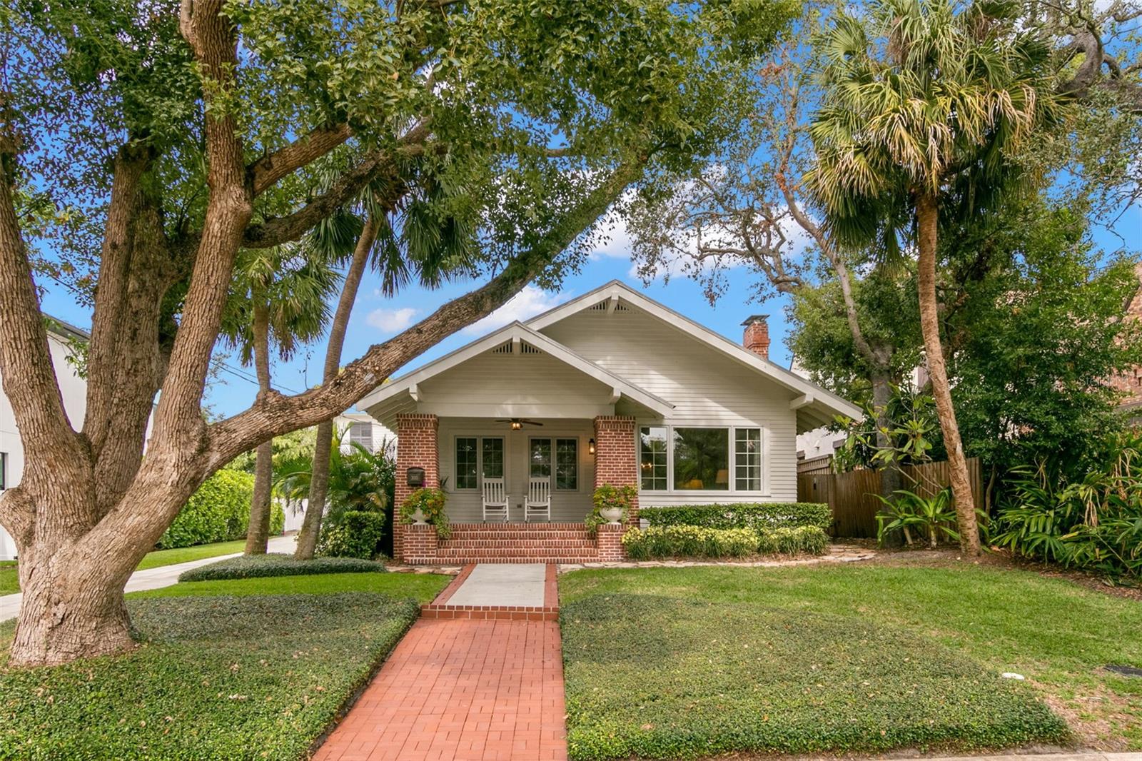 Welcome to the coveted neighborhood of Bayshore Beautiful! This vintage one story home has 3 bedrooms and 2 baths in the main house with a detached guest house above the 2 car garage with a bedroom, full bathroom, kitchenette & living area. The covered front porch welcomes you into the inviting living room with a gas fireplace & large windows overlooking the street. Enjoy dining in the formal dining room with built-ins or in the eat-in kitchen. The kitchen features stainless steel appliances & loads of cabinet space plus a butlers pantry with wet bar & a wine fridge. The kitchen overlooks the family room with french doors out the low maintenance backyard with brick pavers. The owners suite is spacious and includes a walk-in closet plus a built-in closet, dual vanities and a sunken shower. The 2 secondary bedrooms share a center hall bath. The home boasts high ceilings & wood floors throughout. Additional info: Whole house water filtration system, tented for termites in August 2024 & a metal roof. The house is located in flood zone X but a small area at the Southwest corner of the property is Flood Zone AE. Enjoy all South Tampa has to offer with wonderful restaurants, shops and close proximity to Tampa International Airport plus just a few homes off Tampa's iconic Bayshore Blvd.