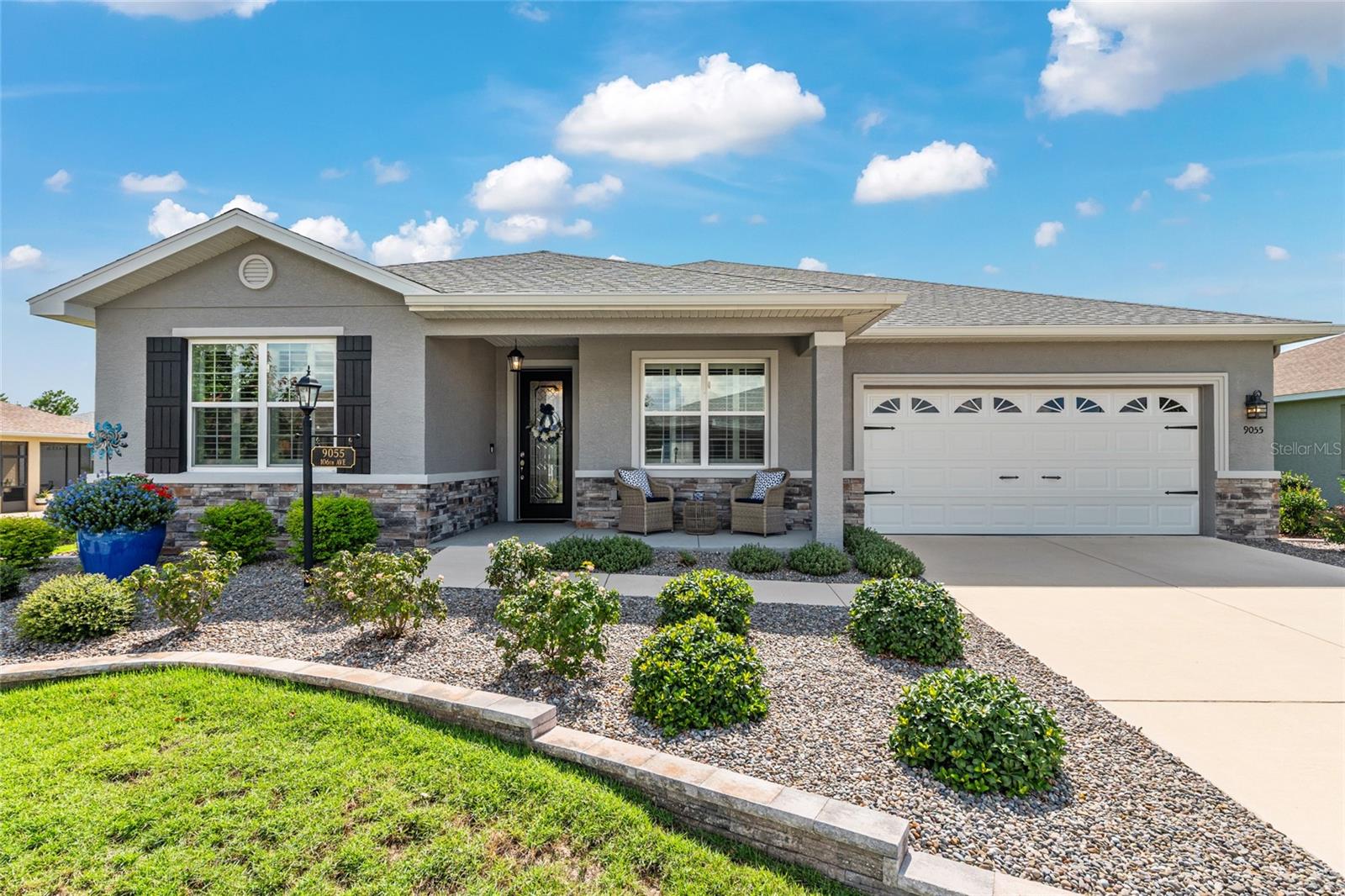 If you are looking for an impeccably maintained, styled, and upgraded newer construction home in the Avalon subdivision of On Top of the World - this is it! Nestled on a premium lot with a privately wooded backyard, this 2 bedroom + den, 2 bathroom Ariana model, built in 2021, showcases over 2,000+ sqft of beautifully designed living space. The Florida-inspired interior features high ceilings with various tray detailing, custom Plantation Shutters and shades, brand-new LVP flooring, and fresh paint throughout. The great room greets you with a centerpiece natural stone electric fireplace, perfect for entertaining. Enjoy hosting from your chef’s kitchen, boasting Granite countertops, custom wooden cabinetry, GE stainless appliances with gas cooktop, and a large eat-in island. Your private owner’s suite leads to an accessible ensuite bathroom, offering a walk-in shower with bench, dual vanities, and spacious walk-in closet. To the front of the home, you’ll find a separate guest wing with a nearby full bathroom, and a cozy den, ideal for quiet relaxation. Enjoy the sunrise from the comfort of your newly enclosed and insulated lanai, or BBQ with friends on the new paver patio surrounded by fresh landscaping. The oversized 2.5-car garage includes golf cart parking, offering plenty of space for your toys and additional storage. Just a short cart ride to OTOW amenities, including The Arbors—this home is the perfect blend of style, comfort, and convenience. Your new lifestyle begins here!