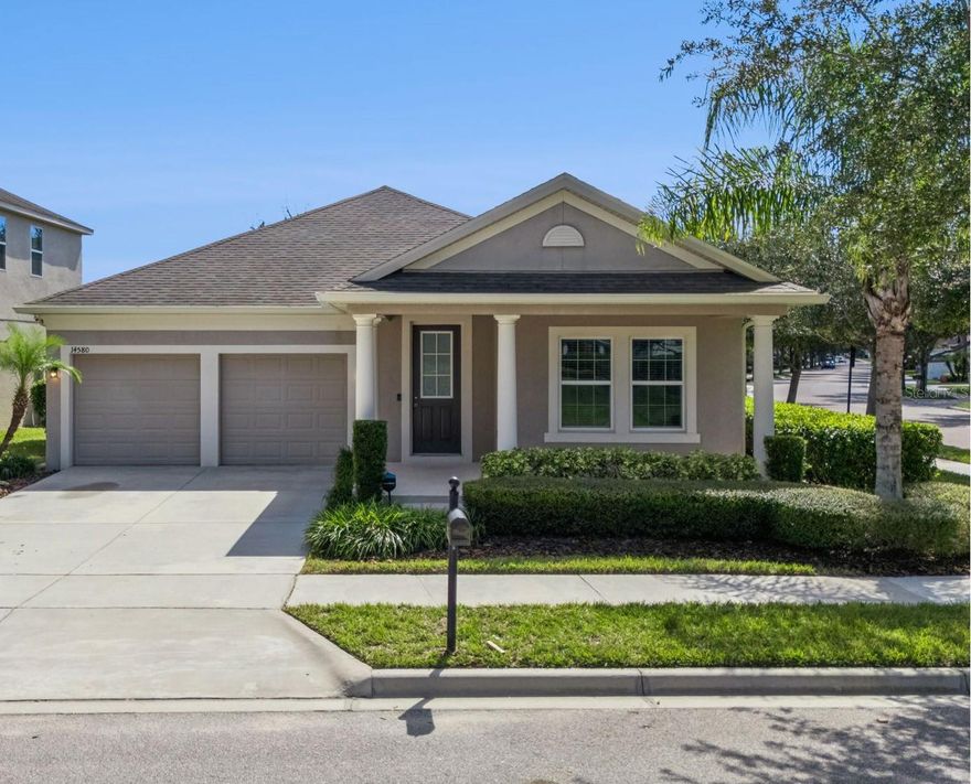 Welcome to this beautifully maintained single-story home in the sought-after Orchard Hills community of Winter Garden. Perfectly positioned on a larger corner lot with a park across the street, this 4-bedroom, 2-bath residence sits within Horizon West.

A spacious front porch welcomes you with peaceful park views. Inside, durable wood-look tile flooring flows through the main living areas. The updated kitchen features modern cabinetry with quartz countertops, a beautiful backsplash, updated lighting, a large island for entertaining, and stainless steel appliances. A single-basin sink overlooks a picturesque window, and a beverage refrigerator is conveniently built into the island. You’ll appreciate the custom walk-in pantry designed to maximize storage.

The kitchen opens to the spacious dining area and family room—ideal for easy entertaining. The family room provides abundant natural light with views of the private backyard. A thoughtful split floor plan separates the primary suite from the secondary bedrooms. The primary suite enjoys generous natural light and a custom walk-in closet. The en-suite bath includes a walk-in shower, garden tub, dual-sink vanity, and beautiful accent tile.

At the front of the home, you’ll find two secondary bedrooms and a full bathroom with a large vanity and linen closet. The front bedroom offers custom shelving and functions perfectly as a home office. The third secondary bedroom includes a walk-in closet. The separate laundry room features cabinetry, along with the washer and dryer. Off the family room, an oversized screened lanai provides plenty of space for outdoor entertaining.

The fully fenced backyard includes an additional paver patio—great for a fire pit—and is spacious enough to accommodate a future private pool. Additional thoughtful touches include storage cabinets in the utility room and gutters.

Community amenities feature a resort-style zero-entry pool, fitness center, multiple playgrounds and green spaces, a dog park, and a clubhouse hosting regular events such as food truck nights and holiday activities. HOA includes lawn care. The home is conveniently close to Hamlin Shopping Center, Winter Garden Village, and major expressways including the 429, Florida Turnpike, and 408 for an easy commute to Downtown Orlando or the airport. Enjoy a quick drive to Downtown Winter Garden for weekly farmers markets and festivals, with convenient proximity to Disney. It’s also less than 1.5 miles from the under-construction Horizon West Regional Park and upcoming Horizon West Library.
Zoned for A-rated schools—Keenes Crossing Elementary, Bridgewater Middle, and Windermere High. With no waiting for new construction, a premier lot, and numerous upgrades, this home is move-in ready and won’t last long!
