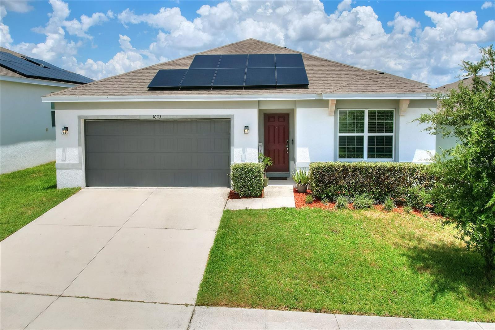 WHY WAIT FOR NEW CONSTRUCTION? This 4/2/2 is in pristine condition, close to community amenities for your enjoyment! Located close to Highway 27 and I4, this location is ideal for commute to Tampa, Orlando, Clermont, making it ideal for visiting Central Florida’s theme parks. Upon entering, you will note the spacious corridor that draws you in. Tile flooring adorns the common areas of this home, ideal for keeping her clean. The spacious rooms are arranged in a split floor plan, which permits you to reimagine their use - office, crafts, or the original intent for bedrooms. Onto the open kitchen, dining, and living area, you will be greeted by natural light from the windows, spacious kitchen with large closet pantry. The stainless steel appliances, quartz countertops, and oversized sink add to the functionality of this open space, ideal for entertaining. Moving towards the owners suite, you will be amazed by the oversized en suite and closet with plenty of room for YOUR wardrobe. Venture outdoors, where the covered lanai awaits. A new vinyl fence secures the perimeter of the yard. This GEM is waiting for you - don't delay!