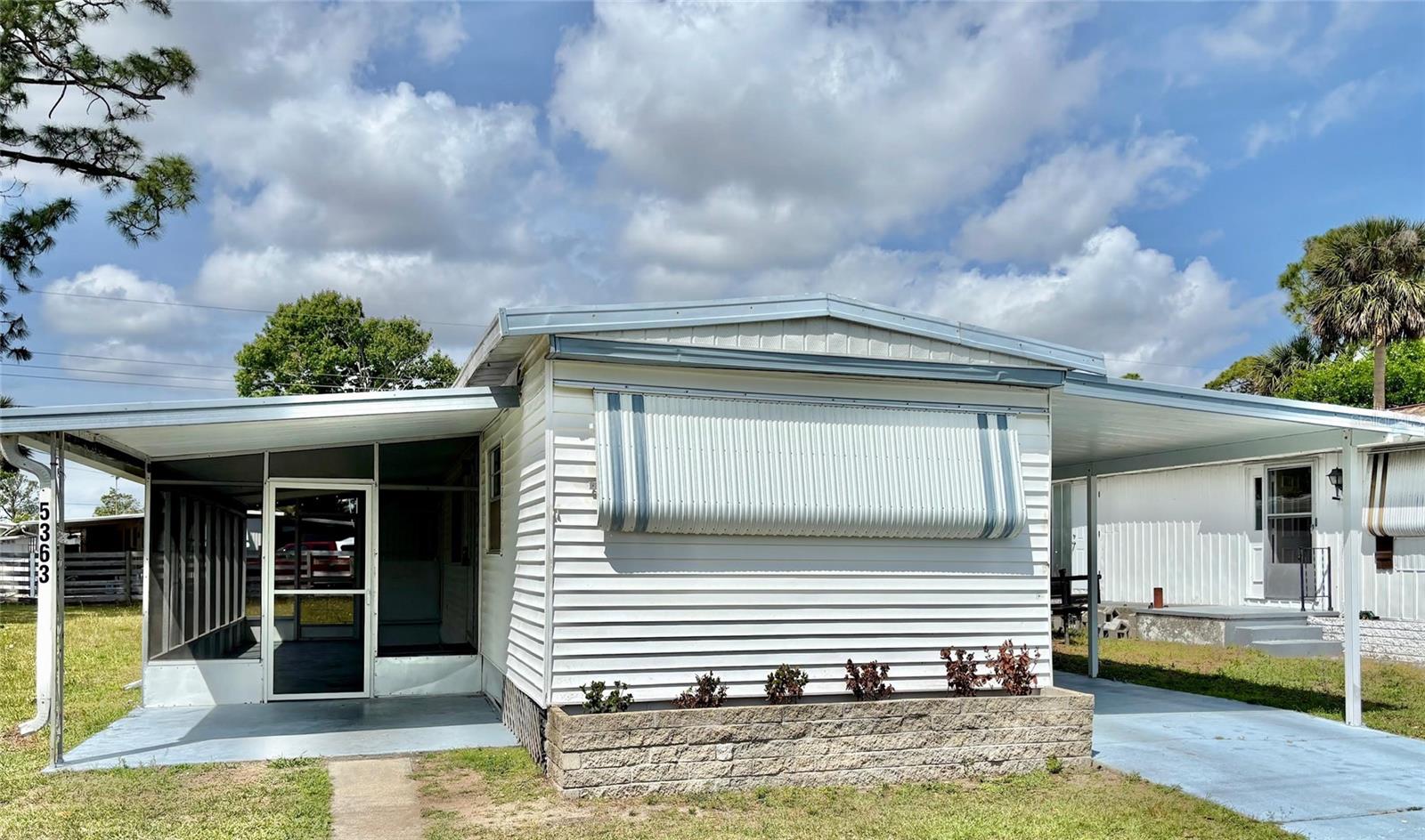 NEW ROOF July 2025! Fully RENOVATED!! FINANCING OPPORTUNITY AVAILABLE! This single wide 2 bedroom 2 bath manufactured home built in 1971 with NO LOT RENT or NO AGE RESTRICTIONS has been rented out up until December 2024. This unit has Central Heat and Air, Spilt Bedroom both with full bathrooms. Tandem covered parking with storage shed, and a large screened in porch that has washer/dryer hook ups. This property is close to public transportation, shopping, restaurants, entertainment and employment opportunities. RENOVATIONS JUST COMPLETED - NEW Completely Redone Hall Bathroom starting with reinforced floor to include new vanity, shower inset, toilet and lighting. Kitchen cabinets, Completely being painted inside, NEW front and back entry doors installed, New waterproof Vinyl Flooring, New Ceiling Fan Lighting fixtures in bedrooms and living room and New full size water heater. Opportunity to put this unit in a package deal with up to 3 other listings, more info on request. All information deemed reliable however not guaranteed.