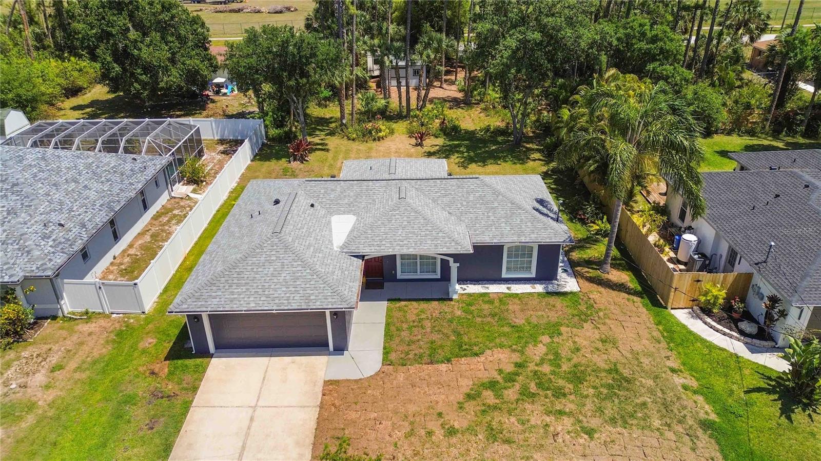Welcome to this beautifully maintained 3-bedroom, 2-bathroom home, perfectly situated on a generous half-acre lot in the heart of North Port, Florida. This move-in-ready residence offers a rare combination of comfort, space, and privacy—ideal for both full-time living or seasonal enjoyment.
Step inside to discover a thoughtfully designed split-bedroom floor plan featuring a bright and open layout, perfect for everyday living and entertaining. The spacious living area flows seamlessly into a well-equipped kitchen with ample cabinetry and modern appliances. The primary suite includes a large walk-in closet and an en-suite bathroom for your comfort, while the two additional bedrooms and full guest bath provide plenty of room for family, guests, or a home office.
Freshly updated and meticulously cared for, this home is ready for its new owners with tile flooring throughout, neutral paint tones, and updated fixtures. Sliding glass doors lead to a large backyard oasis with endless potential—whether you envision a pool, detached garage, garden, or space to park your boat or RV. With no HOA, no CDD fees, and no deed restrictions, the possibilities are endless.
Conveniently located just minutes from I-75, local shopping, dining, schools, Whether you’re a first-time buyer, investor, or looking to downsize without sacrificing outdoor space, this property is a true gem in one of Southwest Florida’s fastest-growing communities.