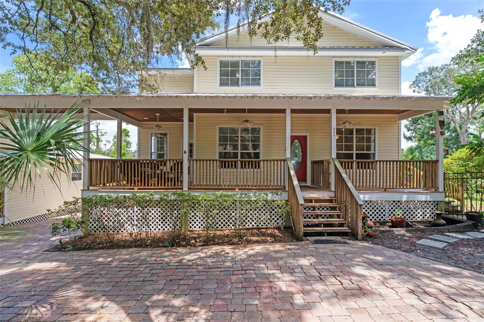 Located in the HEART of Oviedo just one block from Oviedo on the Park, this stunning 4 bedroom, 3 full bath home comes with a pool and a 1 bedroom, 1 bathroom guest house. Set above an expansive 1.56 acres you can view Kennedy Space Center and SpaceX launches from the french door main level patio and primary suite. First floor features a private office, formal dining, and bonus room that leads to the large eat-in kitchen and family room. This home is also a rare find as it has a basement for extra space. Oversized circular paver driveway, portico and rear parking allow for plenty of room for vehicles, boats, etc. Bring your toys, there is NO HOA. All of the bedrooms are upstairs letting in tons of natural light giving the home an open and breezy feel. Freshly painted, brand new decking, new carpet and new basement door. Metal roof for longevity in the Florida weather. Guest house has interior laundry and a full kitchen. Quiet secluded street. Schedule your showing and come enjoy this relaxing retreat that is still minutes from the center of town. **Tax address is 560 Fern which is the guest house address, Main Home is 564 Fern St**