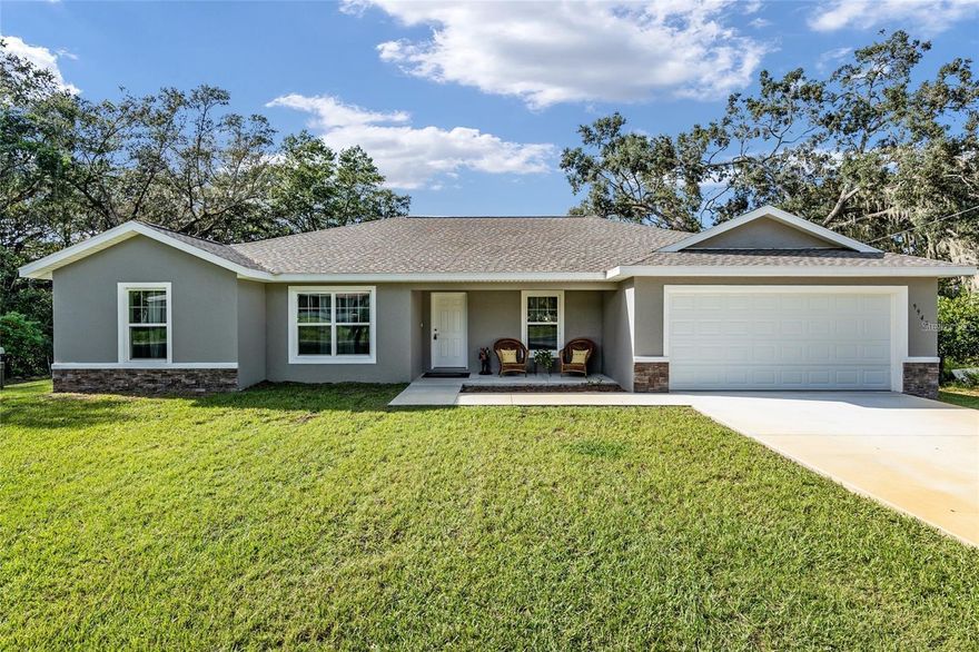 Beautiful, charming waterfront home built in 2023, perfectly positioned on the peaceful shores of Smith Lake, a private, spring-fed oasis ideal for water sports, jet skiing, and outstanding fishing. This thoughtfully designed home includes a versatile fourth bedroom or office/flex space. Enjoy a light and airy interior with neutral tones, luxury vinyl plank flooring throughout, and tile in the bathrooms. The kitchen features a sleek stainless steel appliance package. Step outside to the dock, perfect for taking in the tranquil lake views. Ideally located between Ocala and The Villages, you’ll have convenient access to shopping, dining, and entertainment. Nearby waterfront favorites like Gators Joe’s and Eaton’s Beach are just minutes away. The property also offers a backyard set up for fun and entertaining with a volleyball court, tetherball, and horseshoes. A concrete community boat ramp is located just a few hundred yards away for easy lake access. Whether you’re looking for relaxation or recreation, this private lakefront retreat delivers the best of both. Water softener installed in 2023.