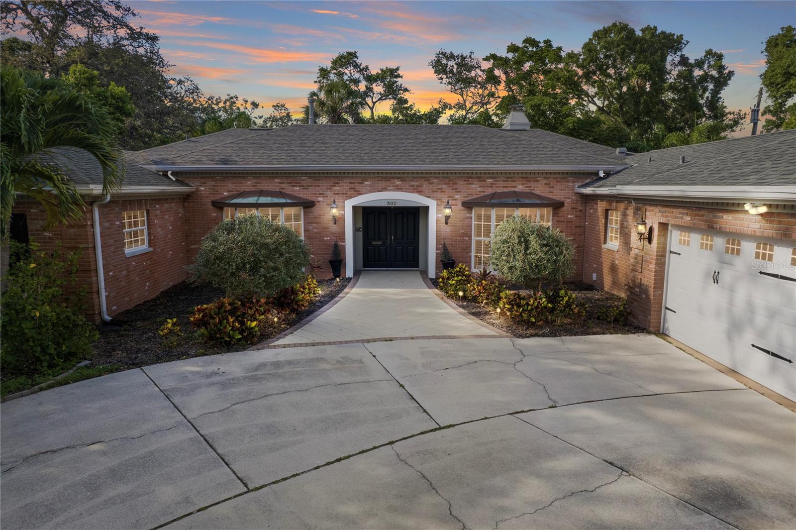 Beautiful Belleair Home Just Steps from Belleair Country Club! Located on a quiet cul-de-sac, this beautifully maintained 3-bedroom, 3-bath home with an office sits on an oversized, high-and-dry lot in a non-flood zone—just a short stroll to Belleair Country Club and minutes from the Intracoastal and Gulf beaches. From the moment you step inside, you're welcomed by a light-filled foyer with a picture window framing views of the lush, private backyard. The home features rich hardwood floors, detailed custom molding, recessed lighting and a wood-burning fireplace, all contributing to its timeless charm. The thoughtfully designed layout offers both comfort and many different design options for office/living/dining rooms. The gourmet kitchen boasts custom cabinetry, stainless steel appliances, and a gas 6-burner range (2024). The spacious primary suite is a true sanctuary, complete with a spa-inspired bath featuring custom vanity, heated towel rack, a large walk-in shower, soaking tub. The custom walk-in closet features desk and built-ins with 2 entrances. Additional highlights include Tesla/EV charger, HVAC with new duct work 2020, a Rinnai tankless gas water heater, washer/dryer (2019) and ceiling fans throughout. Step outside to your own tropical paradise—lush landscaping, a manicured lawn, and a paved patio that surrounds the screened-in pebble tec saltwater pool, creating the perfect setting for entertaining, relaxing, or dining al fresco. This exceptional Belleair home offers the ultimate blend of luxury, comfort, and location—with world-class golf at Pelican Golf Club and Belleair Country Club nearby, plus easy access to waterfront parks, dining, and shopping. Truly a must-see!