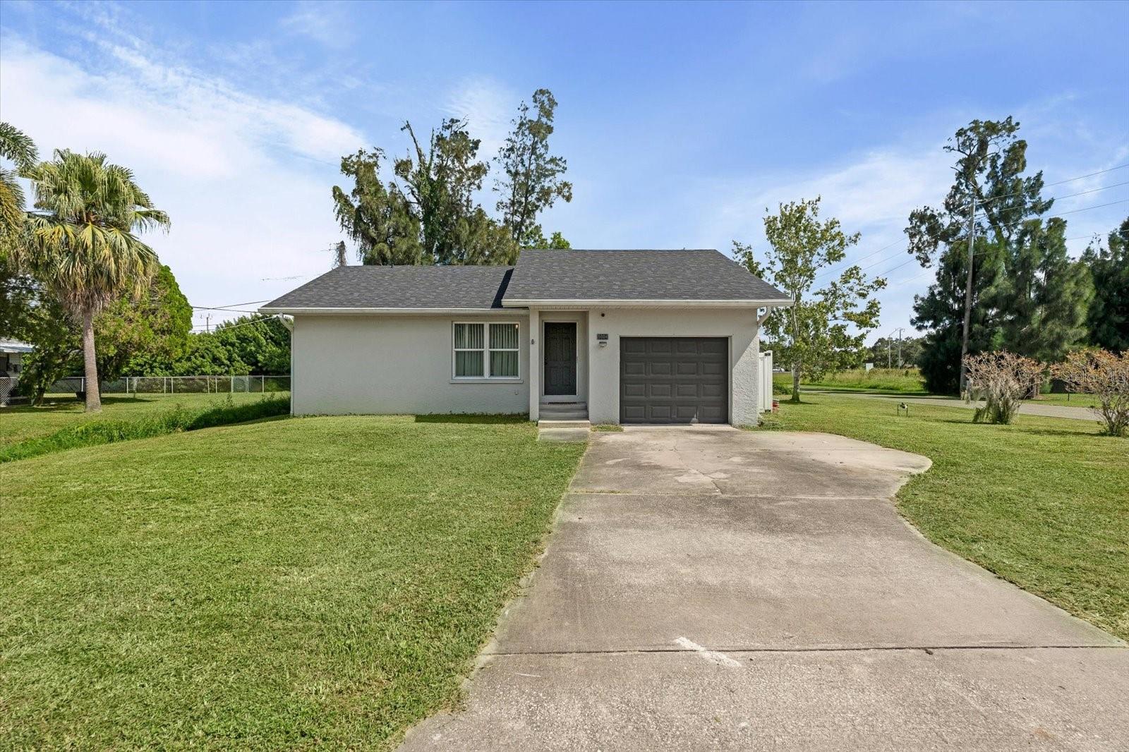 Welcome to 5004 3rd Ave W, a beautifully updated single-family home nestled in the heart of Palmetto Point, Palmetto, FL—a serene coastal community in Manatee County renowned for its proximity to the Manatee River and Terra Ceia Bay. This inviting residence embodies the relaxed Florida lifestyle, making it perfect for families, or boating enthusiasts, with its recent enhancements and thoughtful design ensuring including a 1 year old roof!  move-in readiness. Step inside to an open and airy living space featuring ceramic wood grain tile flooring that flows seamlessly throughout the main areas. The spacious living room showcases a stylish shiplap accent wall with built-in shelving for a large flat-screen TV, offering a versatile area for relaxation or entertainment. Sliding glass doors lead directly to the enclosed lanai, flooding the space with natural light. The adjacent kitchen features warm wood cabinetry, granite countertops, and essential appliances, with a breakfast bar ideal for casual meals or entertaining. Located in the vibrant city of Palmetto, residents enjoy easy access to downtown’s shops, dining, and parks, while the home’s position in Palmetto Point grants buyers the opportunity to join the voluntary Palmetto Point Civic Association (annual fee approx. $275) for exclusive access to a private boat ramp, day dock, and boat/trailer parking, perfect for launching into the Gulf of Mexico or enjoying waterfront adventures.