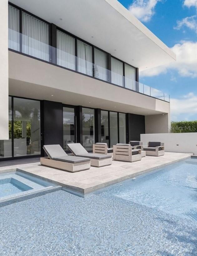 A rare opportunity to make Ocean Park’s most iconic newly built architectural residence your home. Designed and occupied by an American Institute of Architecture award recipient - America's top architecture distinction, the home combines the finest in modernist design and materials. Outside, the eastern facing frontage invites maximum fresh air and sunlight; and on the interior, the open floorplan and stunning white marble floors and floor to ceiling glass throughout present a dramatic composition surrounded by water from two pools, including a house length lap pool. Features include Italian cabinetry, an oversized spa, steam room, a stunning roof deck and lit landscapes. Just steps away from Puerto Rico’s finest beach - also a world class site for kite surfing - this fully custom furnished home offers the ultimate in sophisticated turnkey living.
Move right in to your dream entertainer’s home within a tropical beach paradise and a mere short walk to the areas unlimited dining experiences and the island's top private schools.