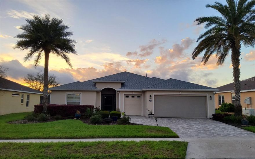 Welcome to your energy efficient home equipped with a new roof (2025), whole house solar panels, natural gas water heater and range, and whole-house backup generator. You’ll enjoy breathtaking waterfront sunsets and 17th Fairway views from the huge 24’x32’ screen-enclosed lanai / patio. This Monarch II design model home, built in 2016 was first occupied in 2018. Enjoy this 1 owner home that has been meticulously maintained and customized featuring retractable electric screens over breakaway sliding doors and garages, plantation shutters, custom pull-out drawers in kitchen and baths, whole home speaker system, 220v hookup for spa on patio, custom paver driveway, beautiful landscaping and more. As you walk through the inviting screen enclosed entry into the foyer, you’ll encounter a spacious, open great room area with cathedral ceilings. Enjoy entertaining in the open-concept kitchen and dining area with granite countertops, tile flooring, stainless steel appliance package, double door pantry, and breakfast bar. The ample sized primary bedroom offers a stand up shower, granite countertops and a walk-in closet. The inside laundry has plenty of space and storage with cabinets and sink. The oversized garage accommodates 2 cars and a golf cart easily. Arlington Ridge is known for their amazing amenities including 18 hole golf course, lighted tennis & pickle ball courts, billiards, heated pools, hot tubs, fitness center, community room, movie theatre, restaurant, tavern, storage lots, and more. (solar panels are financed with about $8,000 left)