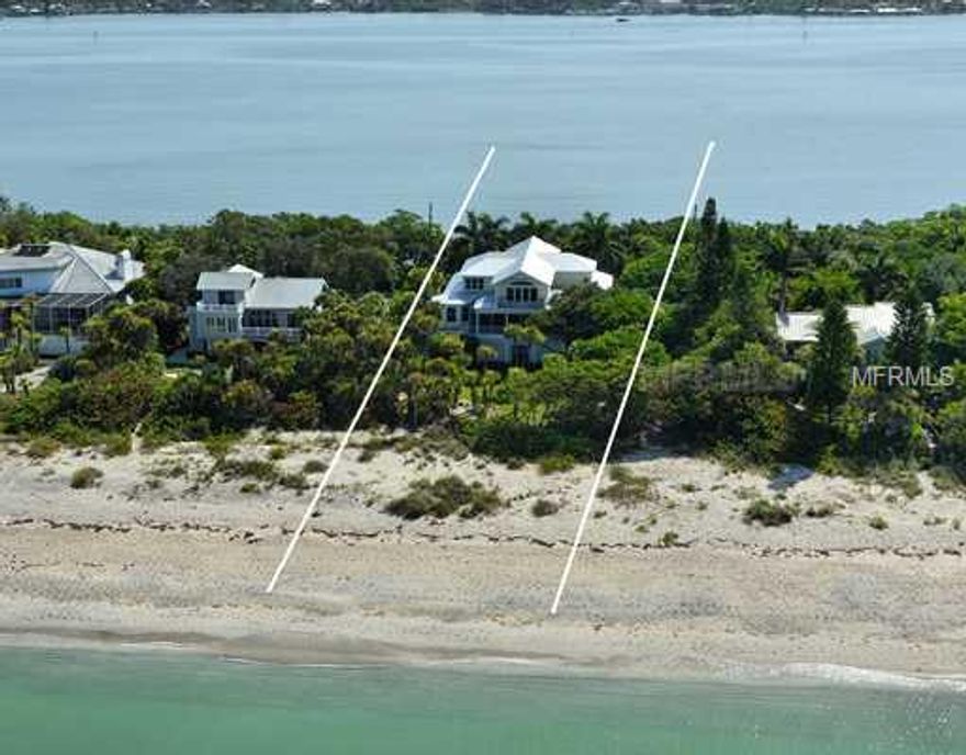 Located on the pristine beach of Manasota Key awaits a gulf-to-bay signature home nestled among century live oak trees and exotic vegetation. Home has over 9,000 square feet under roof with 3 bedrooms, 3.5 baths,  expansive kitchen with center island, over sized family room, separate dining room, dual office, upper and lower  covered balconies and much more. The interior features consist of neutral colors, white washed woodwork, custom wood grained tile, hardwood floors, bay window seating and picturesque views from every room in the  house. Main living area has open floor plan with family room, bar, kitchen, dinette and covered screened porch  facing the gulf and private beach. Home was constructed on concrete pilings and positioned on property to assure park like setting between house and gulf remained natural. Owners recently replaced roof and installed high  impact windows and doors to assure worry free weather conditions. Boaters will appreciate deep water dock with boat lift directly behind home on the Intra-Coastal waterway. I assure you the overall package including  home, private beach, deep water dock , location and price is a winner!