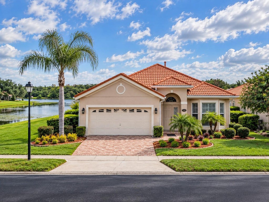 Photo of 5200 Watervista Drive, Orlando, FL 32821 (MLS # O6440624)