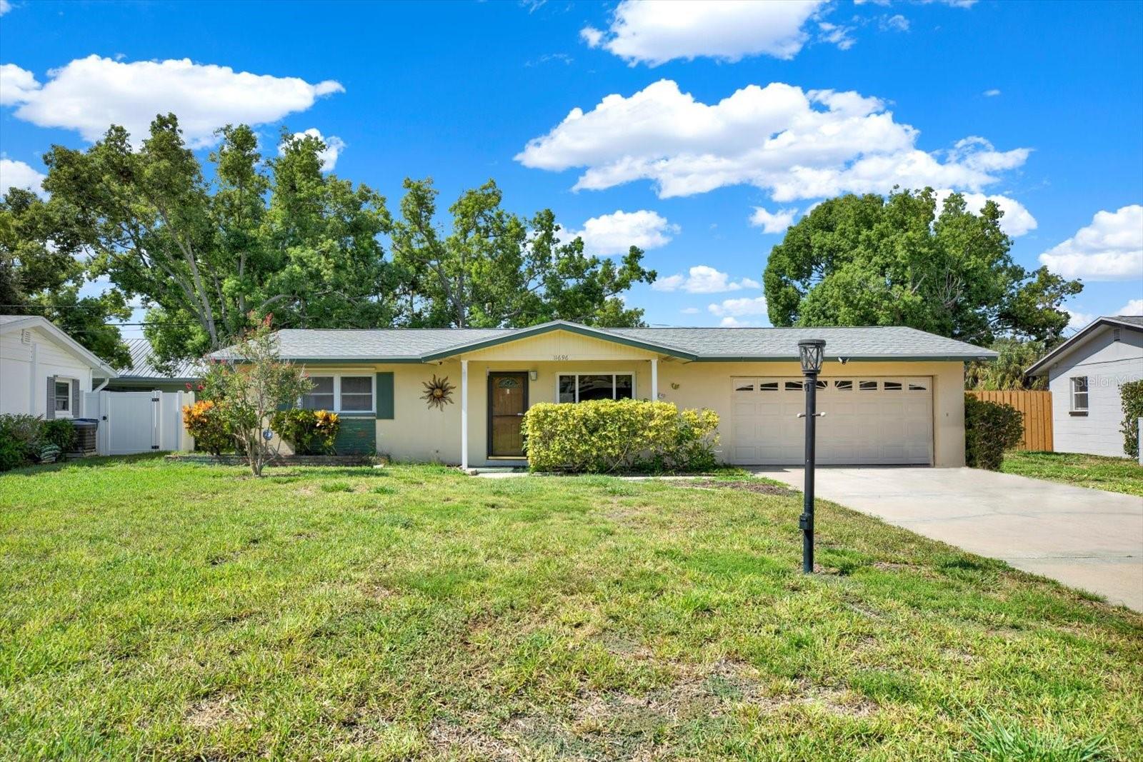 Charming Seminole Home with Endless Potential -- Welcome to 11696 75th Ave, nestled on a quiet street in the heart of Seminole! This solid 2-bedroom, 1-bath home offers a rare combination of space, location, and value—perfect for first-time buyers, down-sizers, or investors looking for a smart opportunity. Featuring a spacious living room and additional family room, this layout offers flexible space for relaxing or entertaining. Enjoy durable terrazzo and tile flooring throughout, a 2-car garage, and a large double driveway—plenty of room for guests, toys, or extra storage. Also located in the garage is a washer and dryer for ease of use. Step outside to your screened-in patio, ideal for morning coffee or Florida evenings without the bugs. The metal hurricane shutters offer peace of mind, and the home sits in a non-flood and non-evacuation zone—a major bonus! Big-ticket updates have already been done for you: ?? New Roof (approx. 1 year old), ?? New Water Heater, ?? New Stove & Refrigerator, ?? AC (approx. 3 years old). Whether you're ready to move in or want to add your personal touches, this home is move-in ready with room to make it your own. Located just minutes from top-rated beaches, shopping, dining, schools, and quick access to the interstate—you’re truly in the center of it all. Don’t miss your chance to own a well-maintained home in a prime Seminole location—schedule your private showing today!