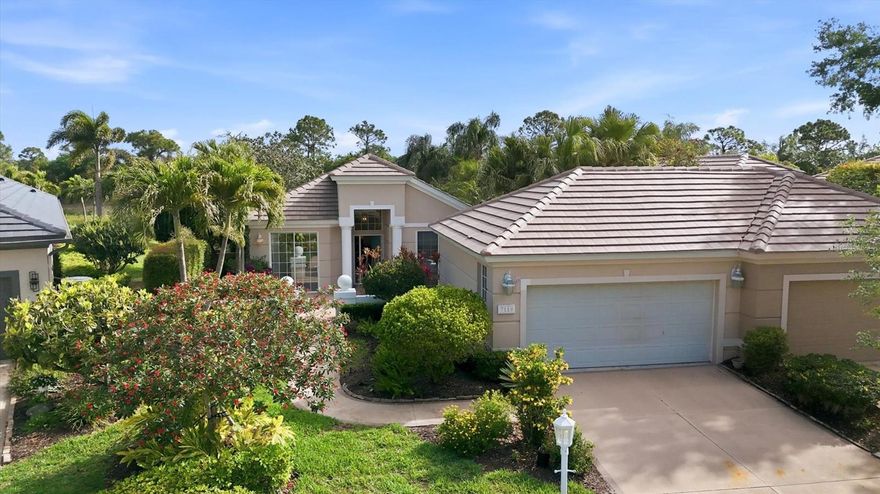 Welcome to award-winning University Park Country Club, where timeless elegance meets effortless Florida living. Located in the maintenance-free Notting Hill neighborhood, this beautifully maintained 2-bedroom, 2-bath residence with a versatile bonus room offers a move-in ready opportunity with thoughtful upgrades and an ideal open-concept layout.

A charming walkway and driveway, surrounded by lush landscaping, lead to the home and its air-conditioned detached 2-car garage. Inside, a light-filled foyer with transom windows sets the stage for the bright and inviting interior, featuring high ceilings, ceramic tile flooring throughout, Bermuda shutters, and ceiling fans.

Just off the entry, a flexible bonus space with custom built-ins connects seamlessly to the kitchen and opens to a private front courtyard via double sliders—perfect as a home office, den, or casual dining area. The main living area is designed for both comfort and entertaining, with a spacious open floor plan that unites the kitchen, dining, and living spaces. The kitchen is well-appointed with rich cherry-colored cabinetry, granite countertops, a breakfast bar, and both recessed and under-cabinet lighting. The dining area offers a charming window seat with cedar-lined storage, while the living room features a triple sliding glass door that opens to the lanai. An additional set of double sliders from the kitchen leads to a side patio, enhancing indoor-outdoor flow.

The primary suite is a peaceful retreat with direct access to the lanai through double sliders and includes two closets with built-ins. The recently renovated ensuite bath delivers a spa-like experience with dual vanities, a freestanding soaking tub, and a spacious walk-in shower with bench. A comfortable guest bedroom, also with courtyard access via double sliders, is complemented by a full guest bath with a tub/shower combination. A dedicated laundry room adds everyday convenience.

Step outside to the extended paver lanai, where a covered seating and dining area overlooks a serene pond with a private, tree-lined backdrop—no neighboring homes in sight. This tranquil outdoor space is perfect for relaxing or entertaining year-round.
Recent updates include a NEW A/C (2026) and a TILE ROOF (2025), offering peace of mind for years to come. Furnishings and household items may be available separately, providing a potential turnkey opportunity.

Residents of Notting Hill enjoy maintenance-free living along with access to a community pool and spa, all within one of the area’s most sought-after gated communities.

University Park Country Club is consistently ranked one of the top courses in Florida featuring 27 holes of championship golf; tennis and pickleball; fitness center, croquet – as well as an array of social and group activities.  Just a 15-minute drive outside this peaceful enclave is downtown Sarasota, with shopping, arts & theatres, museums, dining and entertainment, top-ranked healthcare, beaches and SRQ International Airport.  Two miles east of UPCC is the convenience of I-75, University Town Center with over 300 nationally known and homegrown shops, restaurants, fitness studios, services and attractions, the Nate Benderson Park, home of world-class rowing events and the Mote Marine Aquarium.

Enjoy the club amenities with the required minimum of a Social membership at UPCC, which is owned by the residents through a Recreation District.