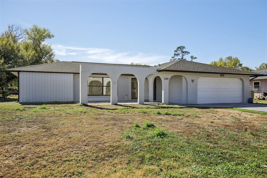 Photo of 23217 Mcburney Avenue, Port Charlotte, FL 33980 (MLS # TB8467097)