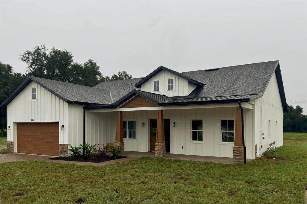 Photo of 8957 SE 12th Drive, Webster, FL 33597 (MLS # O6449756)