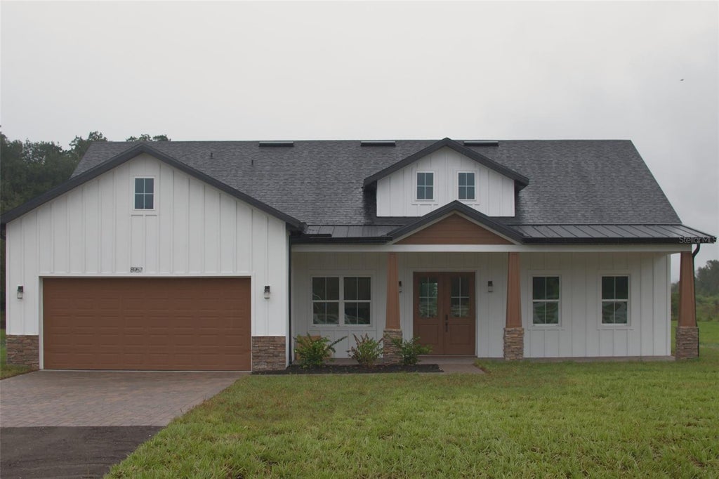 Photo of 8957 SE 12th Drive, Webster, FL 33597 (MLS # O6449756)
