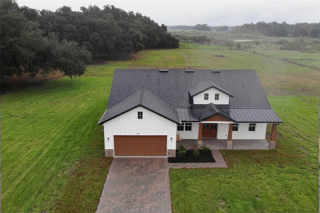 Photo of 8957 SE 12th Drive, Webster, FL 33597 (MLS # O6449756)