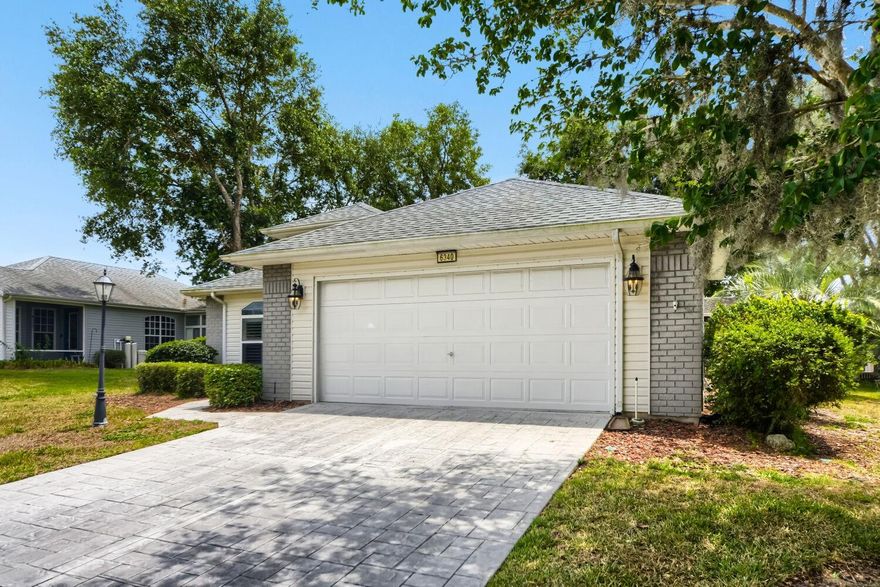 Welcome to 6340 Highland Lakes Blvd, a beautifully updated, truly move-in-ready home in the highly sought-after Highland Lakes 55+ community. This meticulously maintained residence blends modern upgrades with warm, inviting living spaces—perfect for relaxing, entertaining, and enjoying the Florida lifestyle. Step inside to an open, airy floor plan featuring brand-new waterproof luxury vinyl plank flooring, LED lighting, and a custom-designed kitchen complete with solid wood soft-close cabinetry, stunning granite countertops, stainless steel appliances, and elegant pendant lighting over the island. The spacious living area centers around a cozy electric fireplace with shiplap surround and custom built-ins, creating a stylish focal point for gatherings. A generous formal dining room flows seamlessly to the large screened-in porch, offering peaceful views and the ideal spot for morning coffee or evening unwinding. The primary suite is a true retreat—featuring unique flooring, upgraded vanity lighting, and an expansive walk-in closet. A second oversized bedroom and a beautifully renovated guest bath ensure comfort for visitors. The versatile bonus room can serve as an office, gym, den, or additional sleeping space. Fresh interior paint, a new roof, and a new garage door opener add peace of mind and long-term value. Outside, the home is surrounded by mature landscaping and sits within a vibrant, amenity-rich community offering natural fishing lakes, indoor/outdoor pools, tennis courts, a large clubhouse, RV storage, and even a renowned wood/metal shop—all designed to elevate your active-adult lifestyle. This is the perfect blend of comfort, style, and low-maintenance living—your Florida dream home awaits.