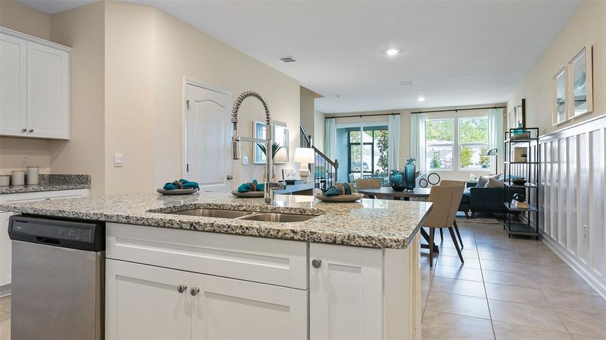 READY NOW! The Wesley is an incredible 2-story townhome with 1,442 square feet, 2 bedrooms, and 2.5 bathrooms. The open concept layout includes a spacious kitchen and airy living room. The kitchen features a large island where homeowners will enjoy preparing meals while entertaining family and friends. Enjoy warm summer evenings on your covered back lanai located just off the living room. The main suite has a spacious bathroom with vanity and walk-in closet. Laundry is also located upstairs for easy access. Plus, you will never be too far from home with Home Is Connected.® Your new home is built with an industry leading suite of smart home products that keep you connected with the people and place you value most.