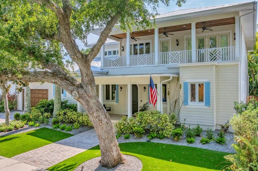 IF YOU ARE LOOKING FOR THE BEST WEST OF TRAIL PROPERTY WITHIN A 5 MINUTE WALK TO SOUTHSIDE VILLAGE, SARASOTA MEMORIAL HOSPITAL, SOUTHSIDE ELEMENTARY AND 2 MILES TO DOWNTOWN, THEN THIS IS THE ONE! Start your morning with a bike ride to Siesta Beach, ranked the number one beach in the USA. Enjoy the sugar-white sand or the turquoise waters of the Gulf of Mexico, and capture breathtaking sunsets in the evenings, all just minutes from your home. Residents of West of Trail can take advantage of a variety of amenities, including parks, playgrounds, and walking trails. Southside Village, a notable park in the area, features a playground, a basketball court, and picnic tables, providing an ideal space for outdoor enjoyment. A short distance away, you'll find Morton's, a gourmet grocery store favored by locals and family-owned for generations, along with a variety of restaurants offering both formal and casual dining. Art stores, shopping, and more are all within biking distance from your new home. The cultural district of downtown Sarasota, with its many attractions, is just a five-minute drive away. Enjoy the Saturday farmers market, numerous restaurants and shops, theaters, live music, art museums, and Selby Gardens. For sports enthusiasts, golfing and tennis facilities are nearby. Families will appreciate the highly-rated Southside Elementary School within walking distance and the nearby Red Rock Park. Memorial Hospital and other healthcare services are less than five minutes away. This home is also just two blocks from the water and comes with numerous amenities. The front porch, with a swinging bench, offers a perfect spot for relaxing with a book. The open concept great room, with over twenty-foot ceilings, is ideal for gatherings with family and friends. The kitchen is equipped with high-end appliances, perfect for practicing your culinary skills. The main level features two suites, a family room with a built-in bar and large TV, making it a great spot for family movie nights. The second floor is a private oasis, featuring a primary bedroom with its own large balcony and two-way fireplace. The spacious walk-in closet and primary bathroom are sure to impress. There's also a room for your Peloton bike and workout equipment, as well as a home office. The outdoor space is fantastic for entertaining! Host gatherings at your private bar, swim in the large pool with fountains, or relax in the spa with a glass of champagne. The backyard is surrounded by lush palm trees, providing both privacy and shade on hot Florida days. 
This home features a spacious attached TWO-CAR garage, as well as a detached ONE-CAR garage, which is currently being used for storage but can easily be converted back into an additional garage.
Book your private tour of this exclusive home to discover all it has to offer. The third car garage is detached which is located behind the fence.