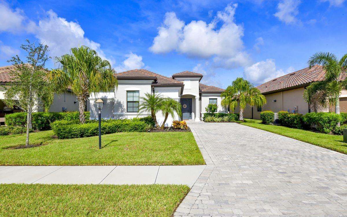 Gorgeous 2 bedroom 2.5 bathroom home in the resort style living gated community of Lakewood National. Professionally decorated with coastal chic furnishings. This is the Popular 1850 sq. ft. VICTORIA model features a clever open floorplan. Master bedroom features en-suite bath with soaking tub, walk-in shower and double sinks. Guest room is located at the front of the home. A den is set up with two extra-large twin beds allow Enjoy your very own private oasis featuring a heated SALTWATER POOL & SPA and a pool bath. Outdoor grill for entertaining guests, grilling and enjoying meals outdoors. PREMIUM Water & Preserve views. Upgraded light fixtures. Custom storage, built in sports racks in garage. This home has everything for the MOST DISCRMINATING GUEST. Located in Lakewood National Golf community. Residents have access to 2 Arnold Palmer designed championship courses. LWN is a golfer's dream. Amazing resort style amenities feature; spa - fitness center - resort style pool - Tiki Bar with food service, har-tru tennis courts, pickle ball - Golf/Membership transfer available.