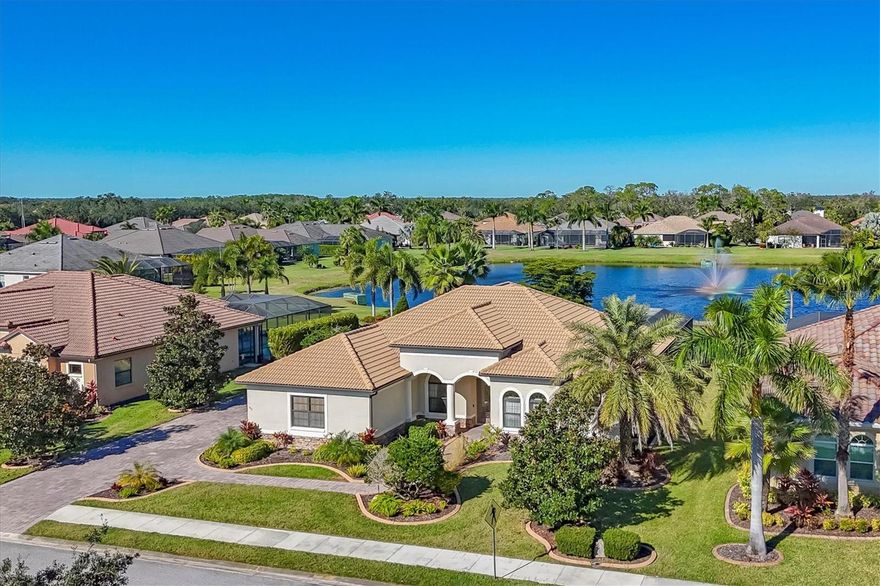 Discover this spacious 4-bedroom plus den/office, 3-bath pool home located in the gated community of the Enclave at Country Meadows.  Situated on a nearly one half-acre tranquil lakefront homesite, this residence welcomes you with a paver walkway leading up to the double glass door entryway. Once inside you will be welcomed into an open floorplan with cathedral ceilings showcasing stunning pool and magnificent water views. This floorplan has a split bedroom design with the primary on one side, three additional bedrooms and two full baths on the opposite side for the ultimate privacy. Enjoy peace of mind with numerous updates, including two HVAC units (2021 & 2023), a new fence (2020), dishwasher (2021), pool pump (2021), refrigerator (2022), irrigation well pump (2023), and a custom built-in breakfast nook bench with storage (2024). The family room features a custom built-in entertainment center ideal for a large-screen TV for family movie nights or watching your favorite sports team.  The outdoor living area flows from inside the home with two covered areas for relaxation, entertaining, grilling your favorite meal, or lounging with a good book. Spacious decking surrounds the pool and spa for the ultimate in Florida living. 
The 3-car side-load garage offers added functionality with cabinetry and slatwall storage. No CDD fees and low HOA dues! Conveniently located near Lakewood Ranch with many dining and shopping options, the UTC Mall, and a short drive to Florida’s beautiful Gulf beaches.