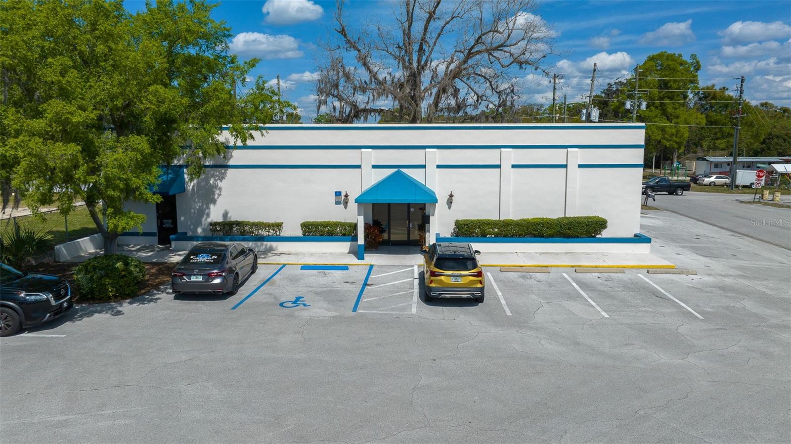 Great 4,000 SF building in the heart of Belleview located right on Hwy US 441/27 across from the new Advent ER and at the Hwy 301 split. Phenomenal high-traffic road visibility with a large monument sign. Positioned for an end-user but could serve as an income-producing property with two tenant spaces. The building is being repainted inside and out, as is the monument sign (Feb 2025). There are two units. One is currently a Home Health company on a month to month in the smaller unit on the left side of the building and could move or stay. That space is approximately 1000SF. The larger unit on the right is vacant and approximately 3000 SF. Lease this prime location up as income producing or let it serve as home to your new business.