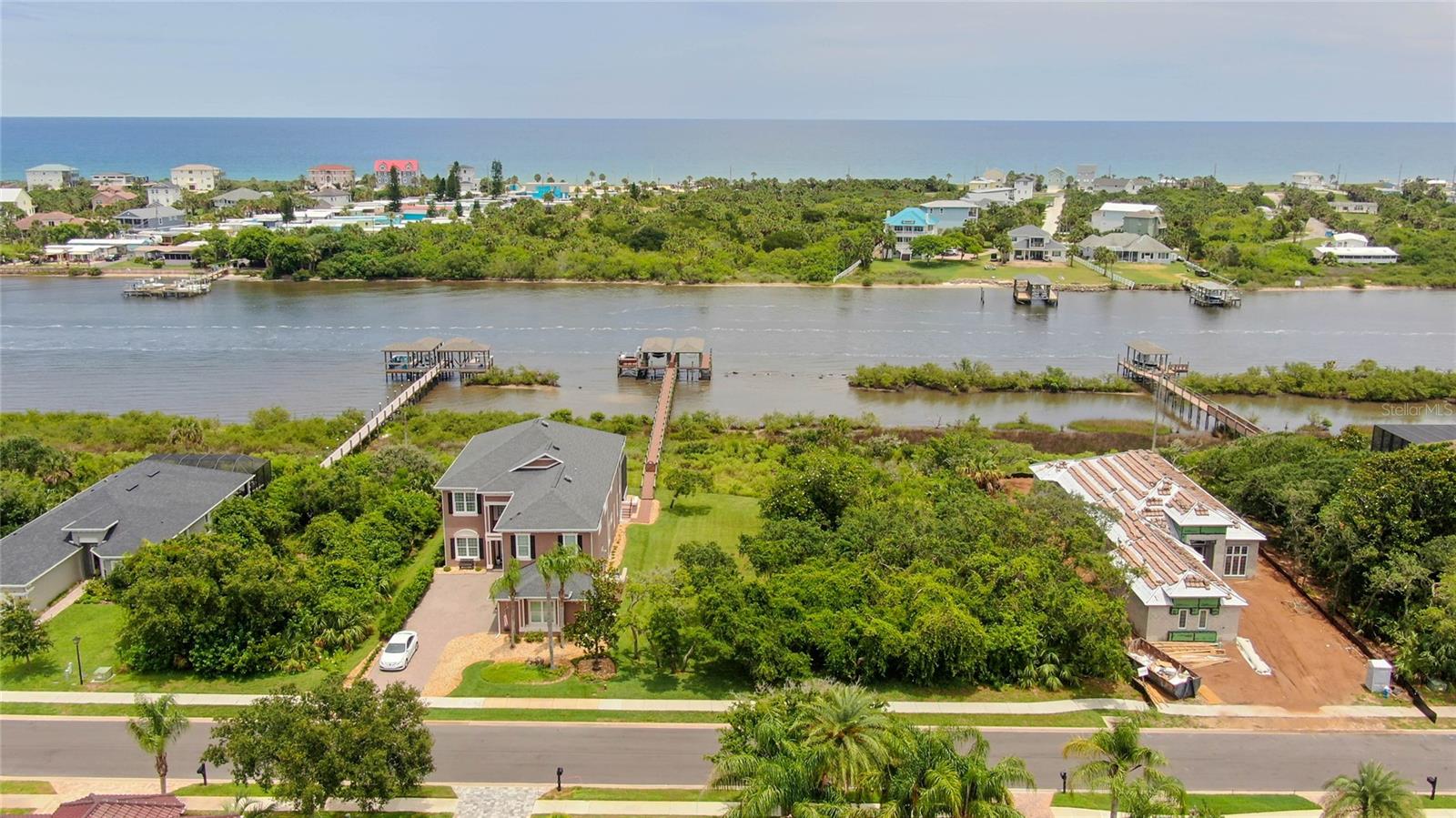 Reduced for quick sale INTRACOASTAL LOT W/ DOCK ALREADY BUILT WITH 32 FOOT BOATHOUSE AND 9000 LBS LIFT located in Palm Coast Plantation. Why buy another lot and go through the dock permitting process when you can buy this lot priced under what it would cost you to replicate? Need a place to keep your boat on a lift while you enjoy fishing on your dock all while building your home? This lot is ready to build on and mostly cleared. If you have recently looked into building a dock, you will see that this lot is saving you time and aggravation! Seller will allow buyers use of electric & water for the dock use until house is built! Start dreaming today with no time frame to build, bring your own custom builder. Take advantage of all the amenities of a community pool, tennis courts, playground, gym and RV & boat storage in this nature lovers paradise in the premiere gated community of Palm Coast Plantation. Only minutes to famous Flagler Beach, shopping, restaurants, medical facilities & more. Lot is part of existing home at 30 N River will be separated prior to closing.