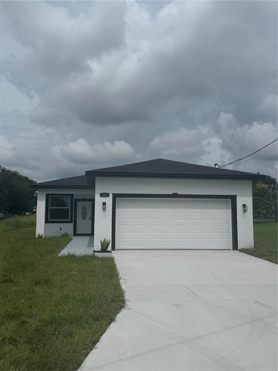 Beautiful Brand new Single Family home ready to move-in! Great location in the middle of Downtown auburndale . Enjoy life with this exceptional new construction ready to make your dreams come true! 3 Bed & 2 Full Bath. Upon walking into the home you are greeted with a gorgeous floorplan with sliding glass doors overlooking the Backyard, the kitchen is fully with quartz countertops, stainless steel appliances; 42'' solid wood cabinets Complemented by impact-resistant windows and luxury vinyl flooring all over the house, all energy efficient LED lights and fixtures; with a large driveway leading to a two-car garage. With no HOA or CDD fees, Schedule a showing Today and Take advantage before it is gone!