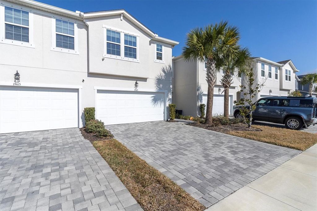 Photo of 19421 Monarch Wind Way, Lutz, FL 33558 (MLS # W7883052)