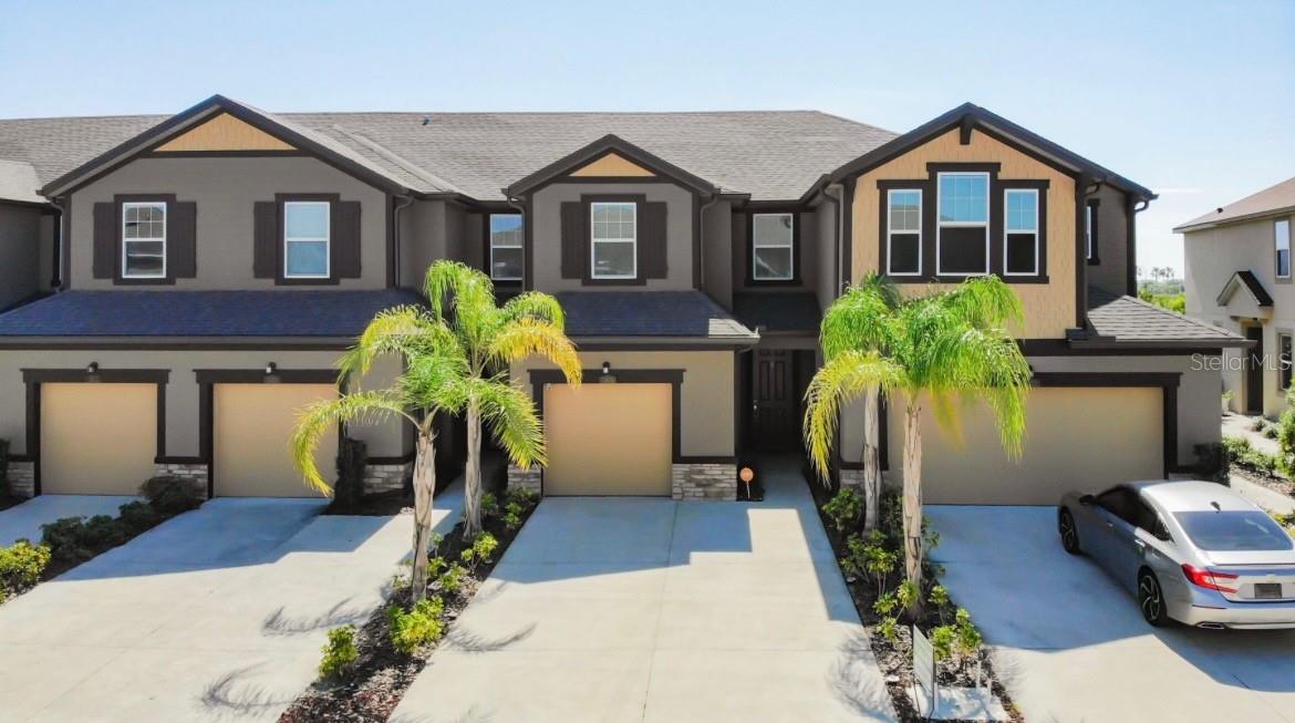 Fantastic opportunity to own this meticulously maintained 3 bedroom, 2.5 bath townhome in great location in Harmony at Lakewood Ranch. Built in 2021, the first floor features a spacious living room, kitchen with quartz island and bar, stainless steel appliances, dining area, powder room, ample storage, and screened patio. The second story features a spacious primary bedroom with walk-in closet, dual vanity sinks, and shower. The two guest bedrooms are separated by the interior laundry room and loft area along with guest bath and tub. Flooring throughout is luxury vinyl tile and ceramic tile, NO carpet. Custom window treatments throughout!! One-car attached garage has been extended for extra parking. The seller has made many upgrades throughout and it shows like a model home. The community has a clubhouse, pool and gym. Close to major highways, shopping, churches, parks, pickleball courts, schools and MORE!! Property is available for lease and/or lease purchase!