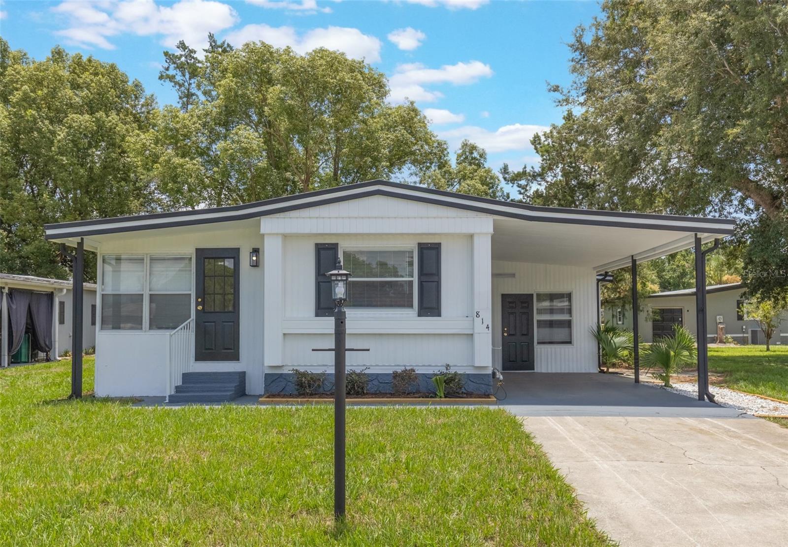 This adorable fully renovated manufactured home is the perfect opportunity to join the amazing community of The Villages! Located in a charming golf cart community, everything in this home is fresh and clean- brand new kitchen, bathrooms, AC, Hot water heater, paint and floors. This home has also been replumbed and has all new windows too! It's like a brand new home! With 2 bedrooms and 2 bathrooms, there's room for a family, a roommate, or use the extra room as your office, craft room, kitty condo, etc! All you have to do is move in and start enjoying the sunny Florida lifestyle.