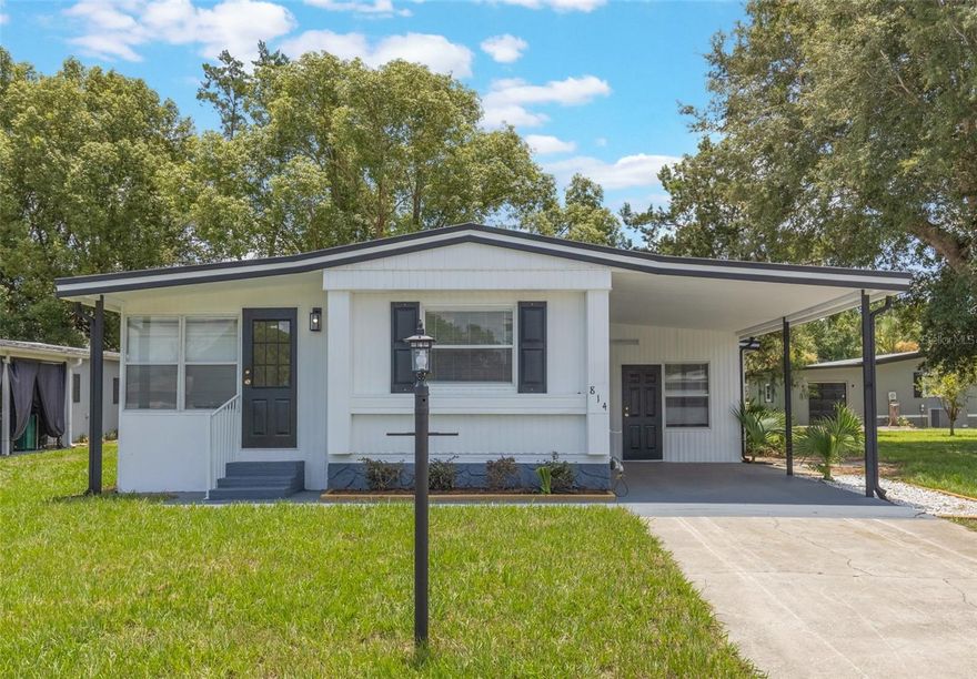 PRICE IMPROVEMENT - This adorable fully renovated manufactured home is the perfect opportunity to join the amazing community of The Villages! Located in a charming golf cart community, everything in this home is fresh and clean- brand new kitchen, bathrooms, AC, Hot water heater, paint and floors. This home has also been replumbed and has all new windows too! It's like a brand new home! With 2 bedrooms and 2 bathrooms, there's room for a family, a roommate, or use the extra room as your office, craft room, kitty condo, etc! All you have to do is move in and start enjoying the sunny Florida lifestyle.