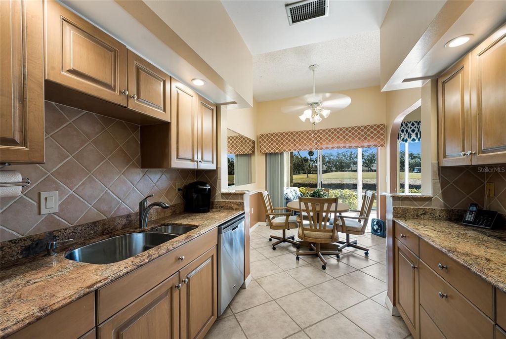 Photo of 5590 Golf Pointe Drive #5590, Sarasota, FL 34243 (MLS # A4680747)