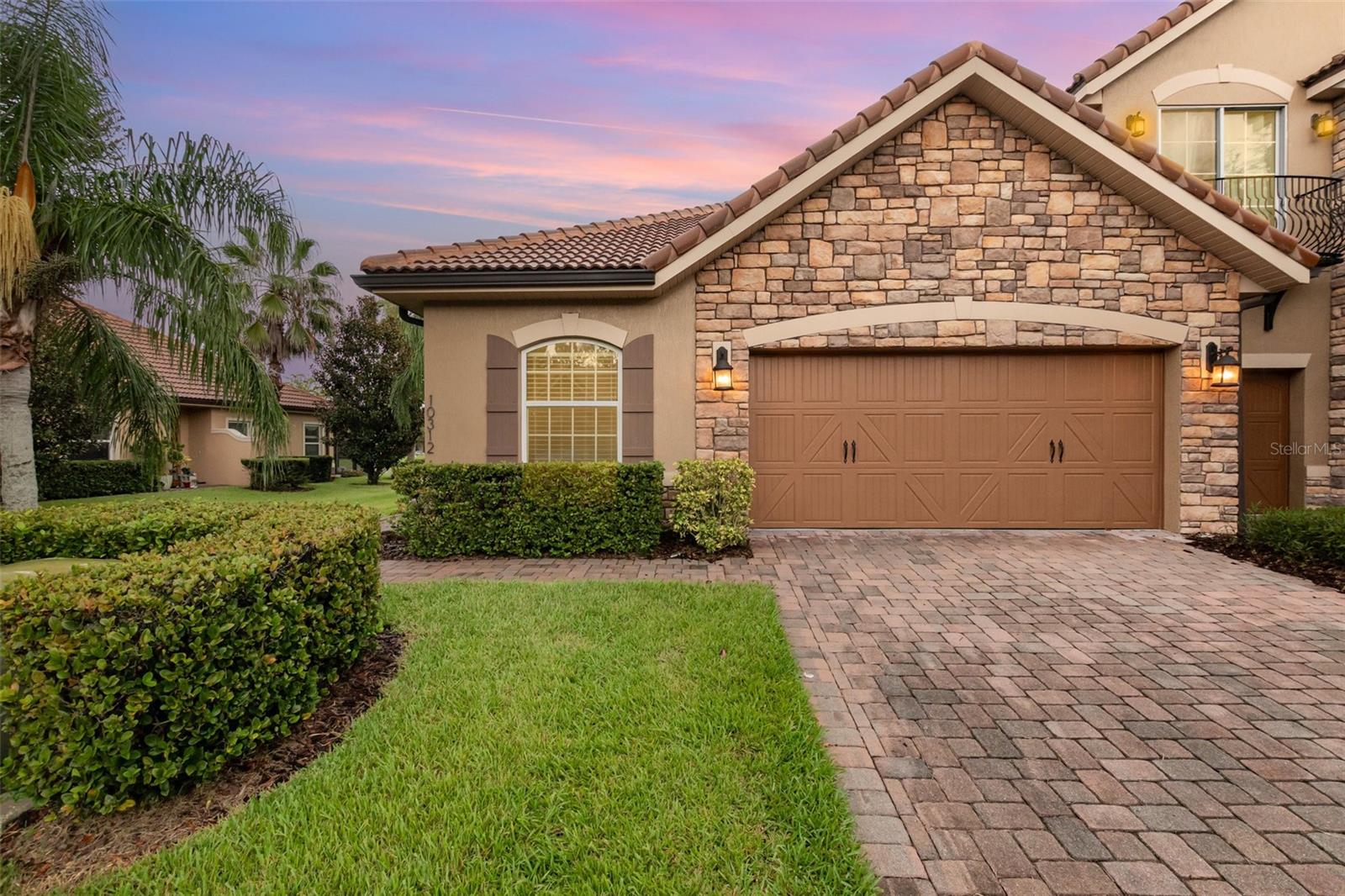 Welcome to 10312 Belfry Cir, a low-maintenance, single-story end-unit waterfront townhome ideal for those looking to downsize without compromising comfort. This 3-bedroom, 2-bath home split plan with a flexible bonus space and 2-car garage is nestled in the guard-gated Eagle Creek community of Lake Nona. Enjoy peaceful living with resort-style amenities, golf, clubhouse, pools, fitness center, and more. Close to top-tier healthcare at Lake Nona Medical City, dining, shopping, and the airport. With a little updating, this house becomes the perfect forever home in one of Orlando's most desirable neighborhoods. While there are a few homes for sale on Belfry, not many of them are a 3 bedroom. While the AC is original, it has been maintained, serviced and blowing cold. The water heater is just a few years old and the roof, though original is tile, so it has tons of life left in it. The home has been professionally cleaned and waiting for your personal touches to make it home.