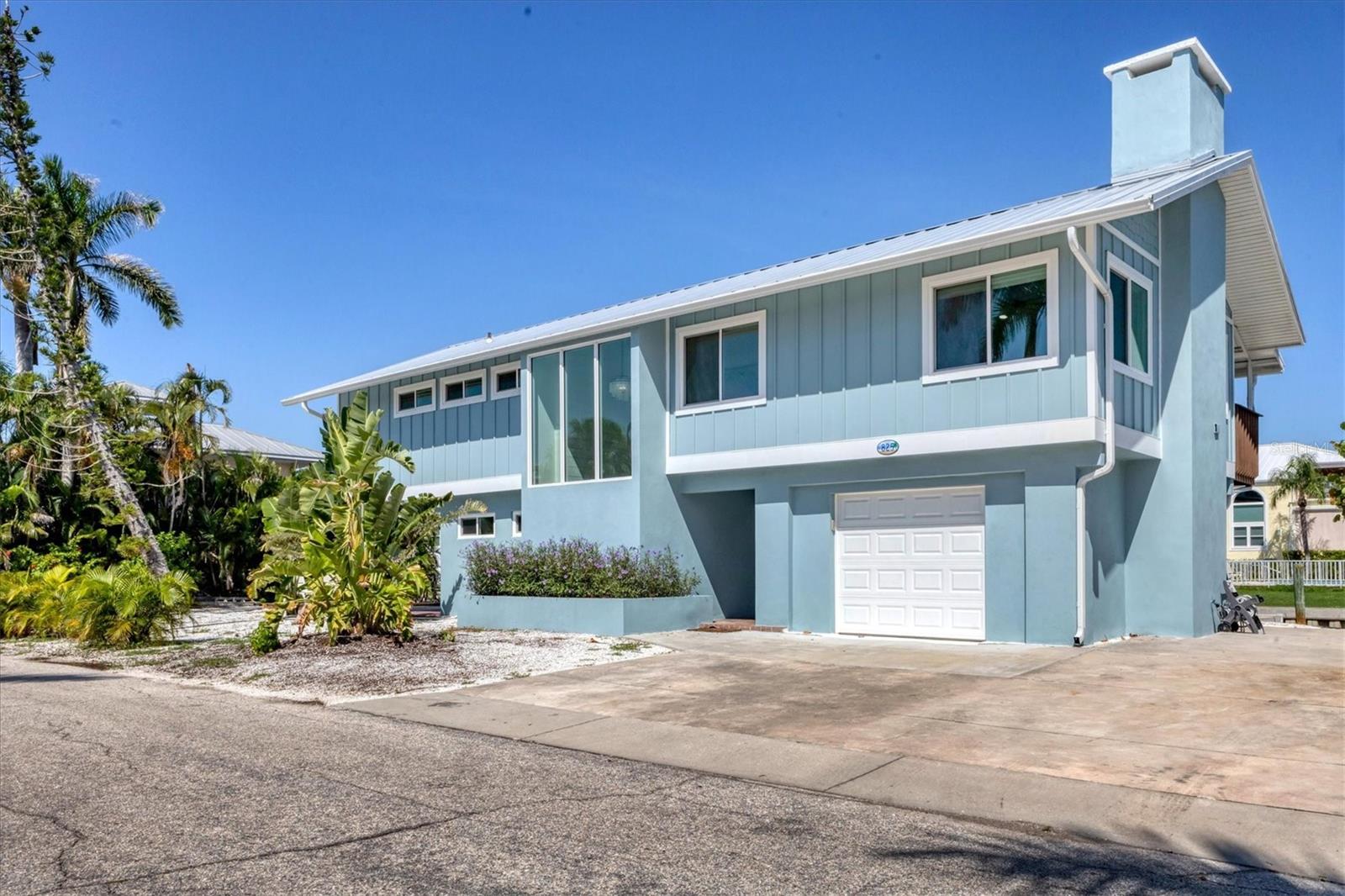 Welcome To 825 Tarawitt Drive! This Beautifully Renovated Waterfront Home Features 3 Bedrooms & 3 Washrooms. Located In The Quiet Community of Sleepy Lagoon. An Open Concept Floor Plan With Gorgeous Bay Views, Perfect For Entertaining! 125 Ft of Canal Frontage. Direct Access To Sarasota Bay. A Jet Ski Lift, Docking For Up To 30 Ft Boat, Outdoor Shower, Above Ground Spa, Spacious Outdoor Area For Dining and Lounging. Renovated Throughout in 2022 With A New Roof, Windows and Doors. Only A Few Minute Walk To A Private Deeded Beach, Restaurants & Shops. Included With An Annual Lease, Gym Membership to Cedars Tennis, Pool and Club.